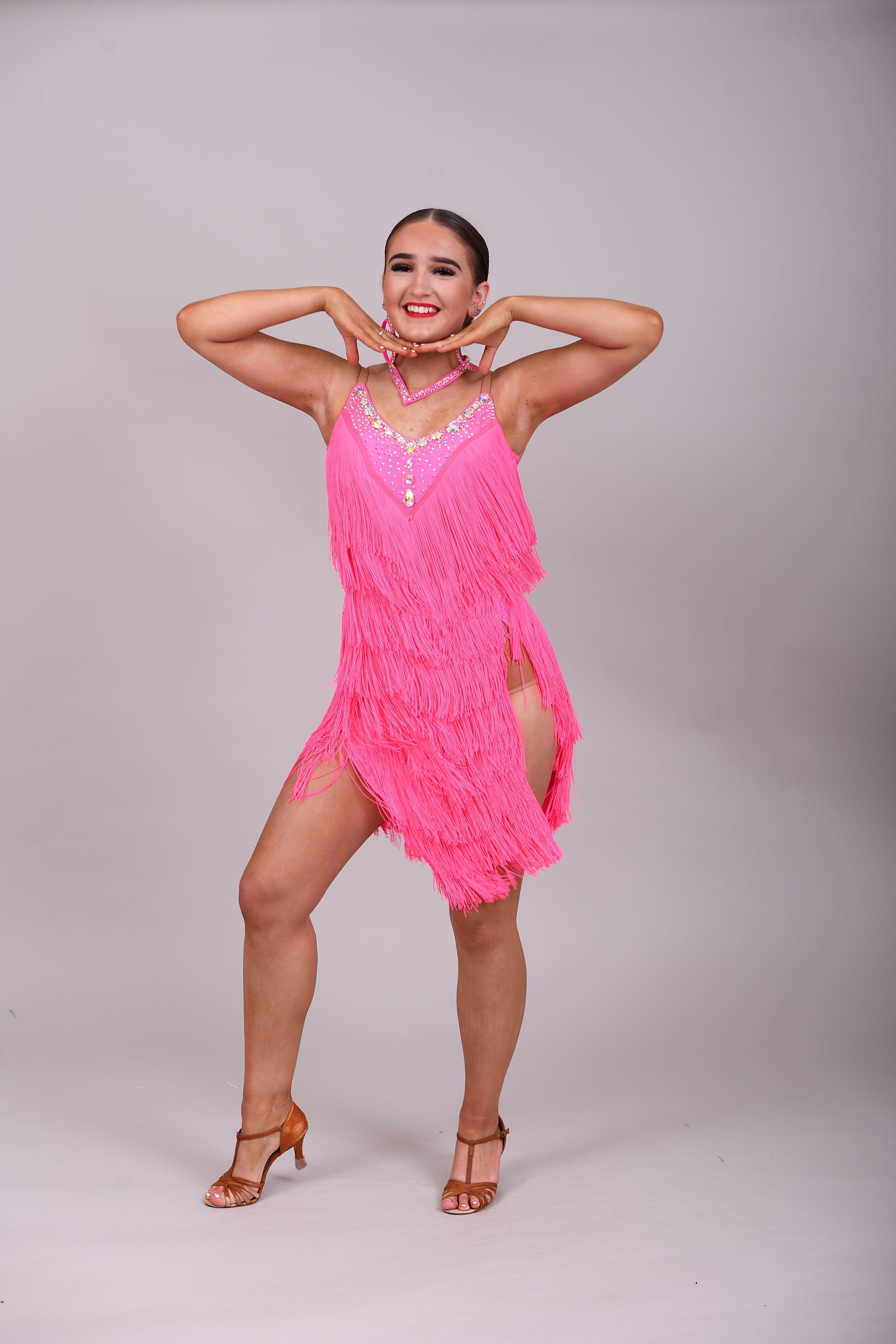 303 Flo Pink Latin Dress. Full fringed skirt decorated in AB Stones & open back detail
