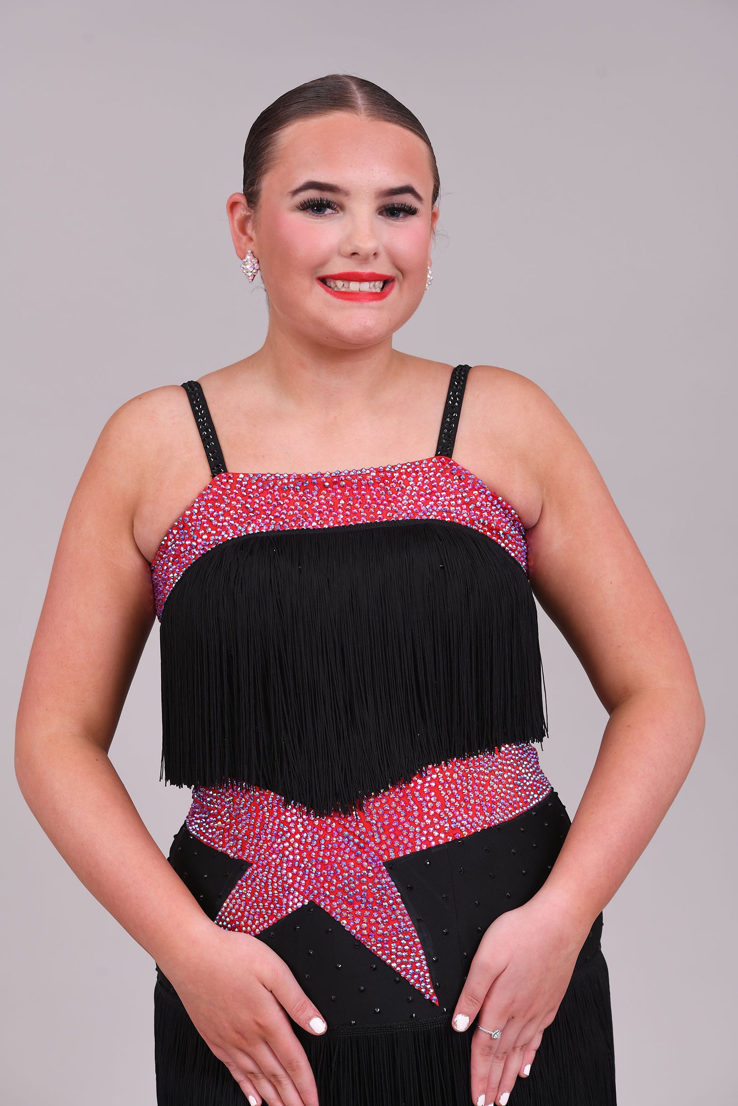 152 Black Latin Dress with full fringe skirt and fringe detailing to the bodice.  Cerise Belt and upper chest panels decorated in Siam AB stones