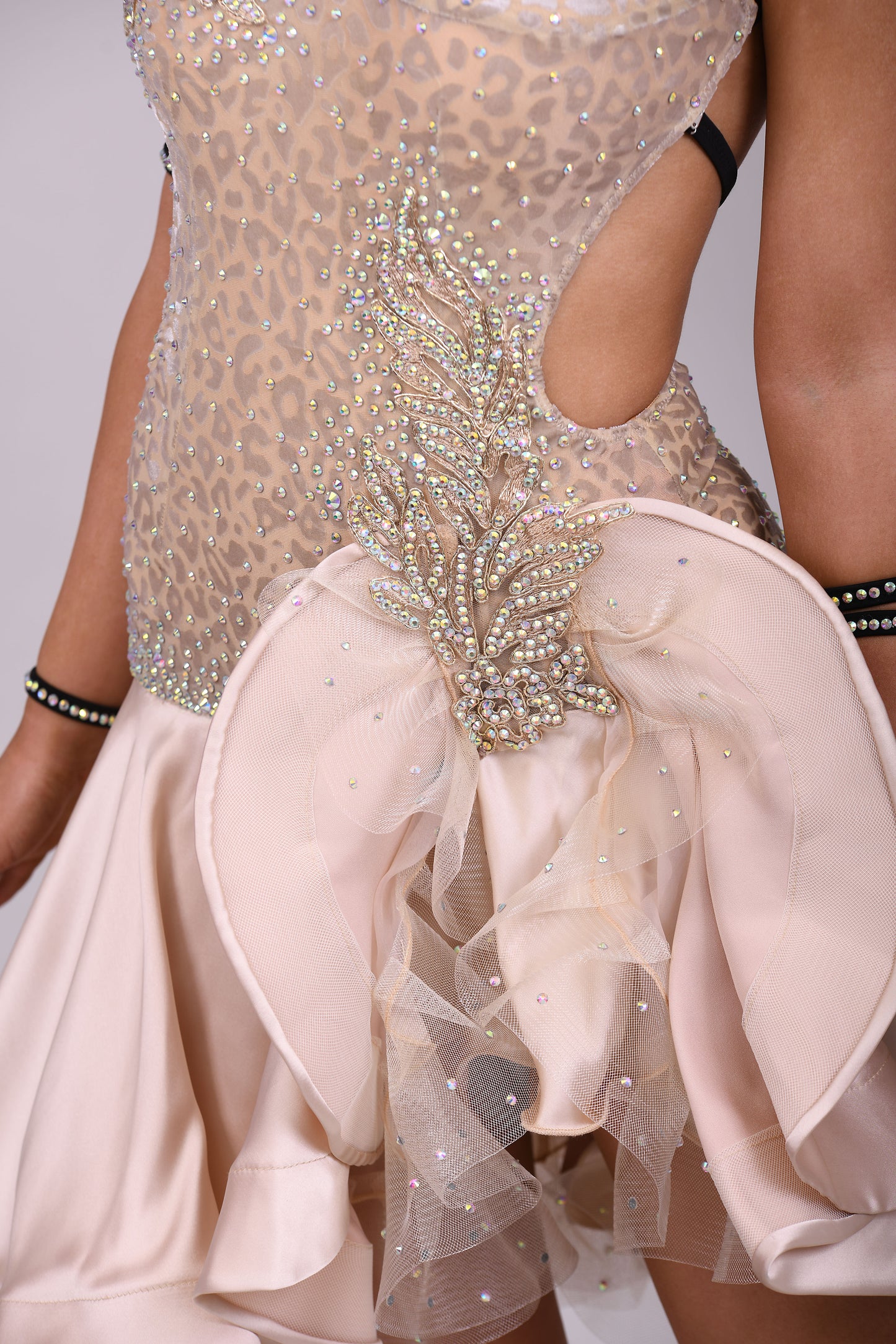 175 Champagne flesh Leopard fabric Latin dress. Soft satin skirt with motif detailing to one hip. Gold appliqué with AB stones