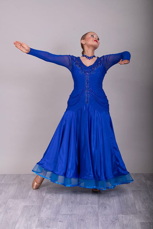 339 Bright Royal Blue Ballroom Dress. Stunning detailing to the back with Strappy detail to the hips. Organza edged in ribbon. All stoned in Bright Royal Blue. Very comfortable Front Zip fastening.