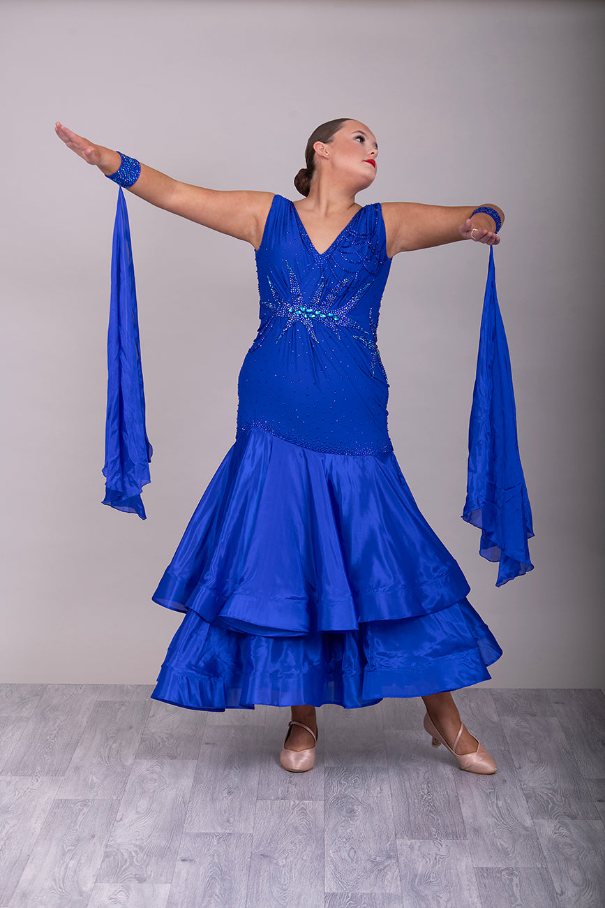 9000 Striking Bright Royal Blue Ballroom Dress. Decorated in sapphire, sapphire AB & aqua. Comes with x2 sets of Detachable floats & stunning necklace.