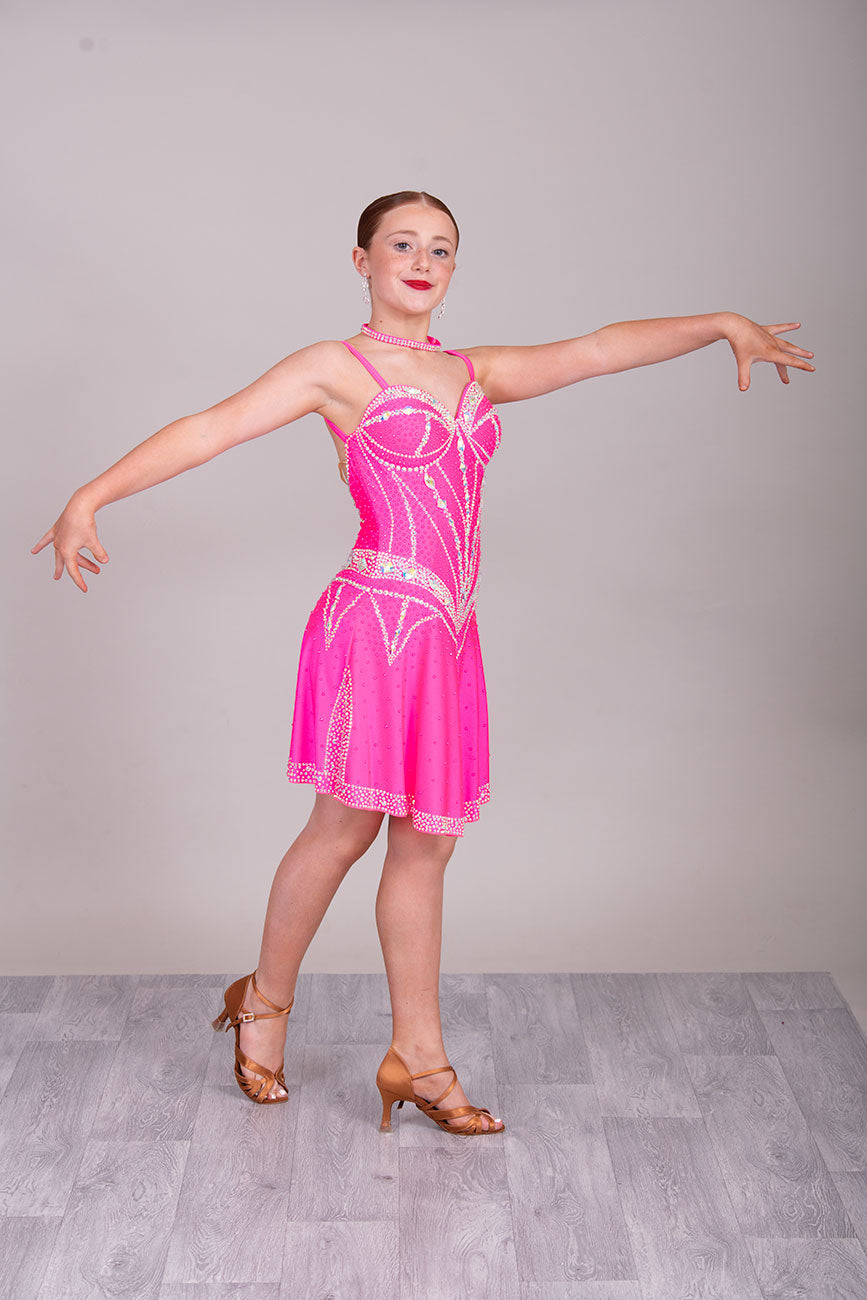 34L Neon Pink Corset style Competition Latin dance dress. Bra cup style bodice with corset effect stoning in AB. Dude splits edged in AB