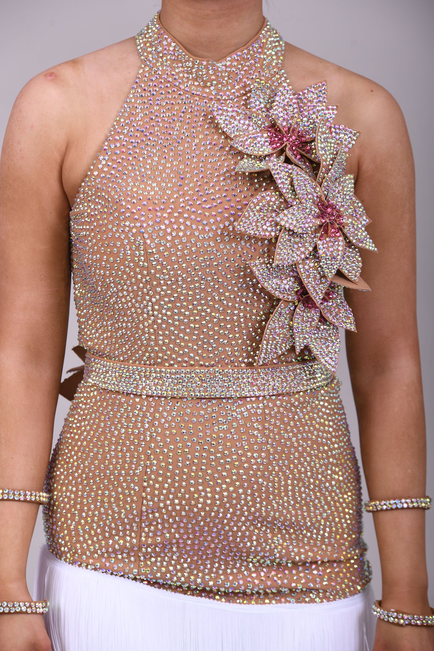 299 Tan & white Latin Dress. 3D flower detailing with white fringe skirt. AB & Rose stoning with separate belt.