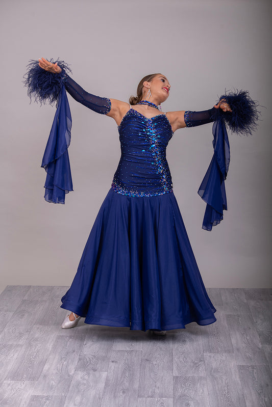 07B Navy Blue Ballroom/Sequence Competition Dance Dress. Stunning Bodice Detail stoned in Sapphire, Capri Blue, Capri Blue AB & Sapphire AB. Cones with Gloves & Ostrich feather cuffs with hanging floats.
