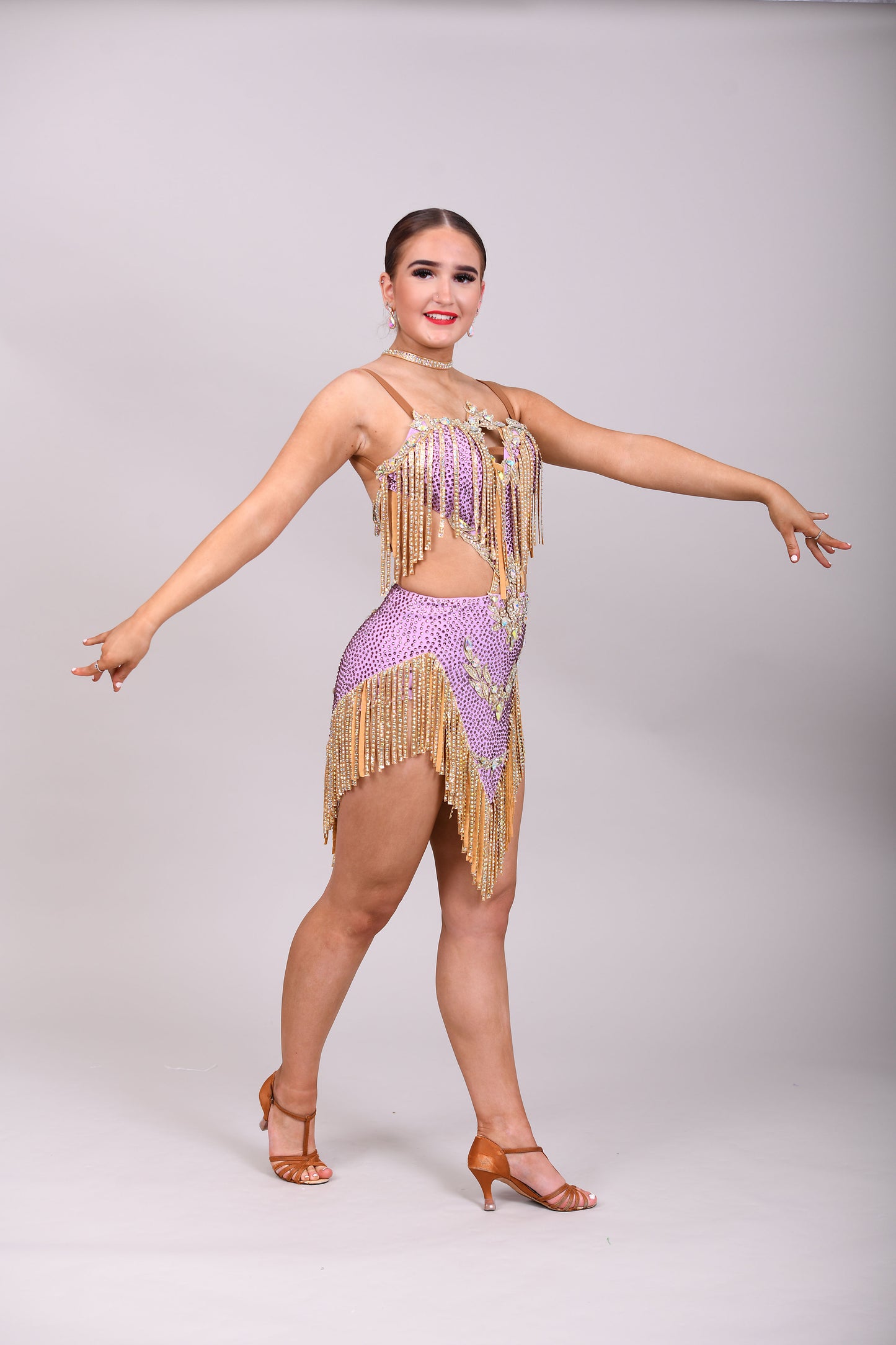 295 Lilac and Gold Latin dress. Gold material droppers stoned in AB. Lilac fabrics all decorated in matching stones.