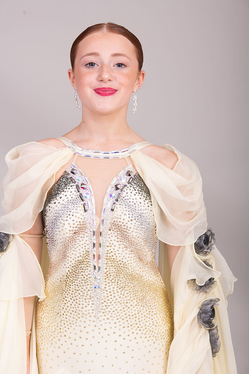 38B TWD PETITE Lemon & Silver Competition Ballroom/Sequence Dress
Stunning Flower detailing to the arm sleeve floats with 
Heavily stoned fabric droppers on the back. Very unusual neck/Shoulder