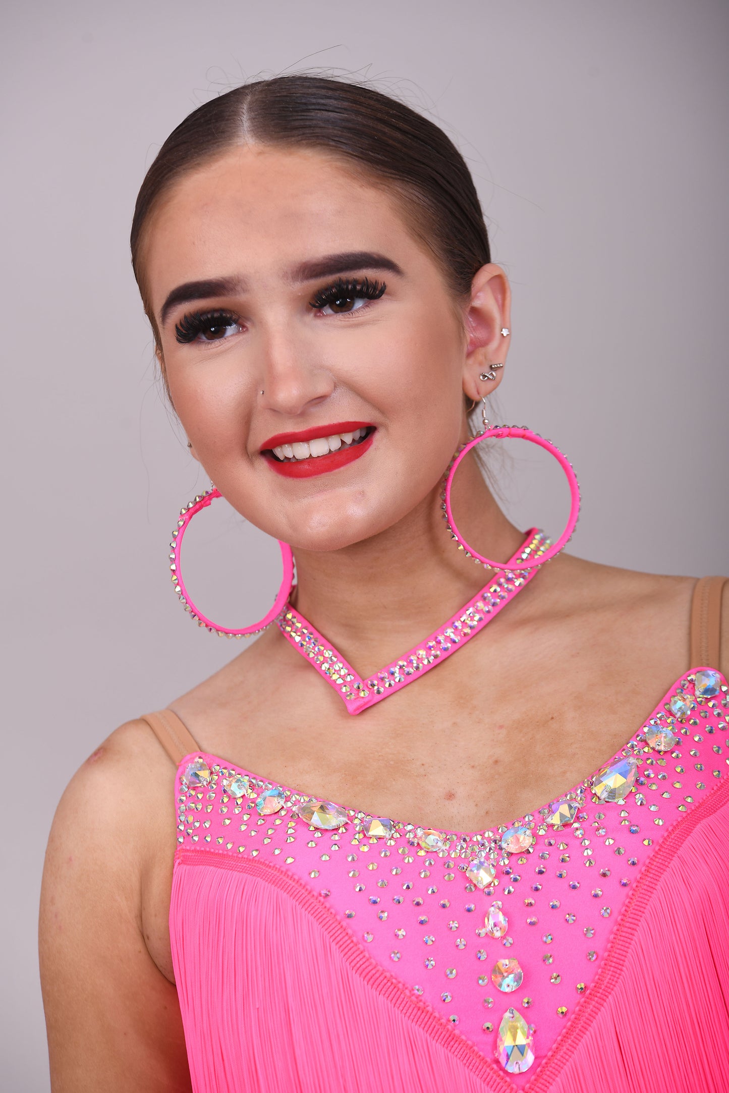 303 Flo Pink Latin Dress. Full fringed skirt decorated in AB Stones & open back detail