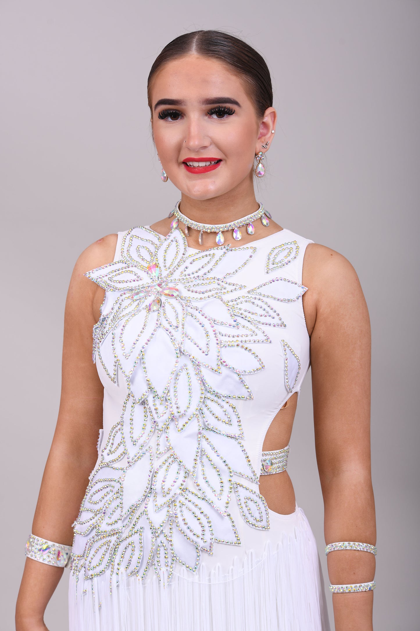 177 White 3D flower & leaf design Latin dress. Fringe skirt with open side detail. Stones all AB