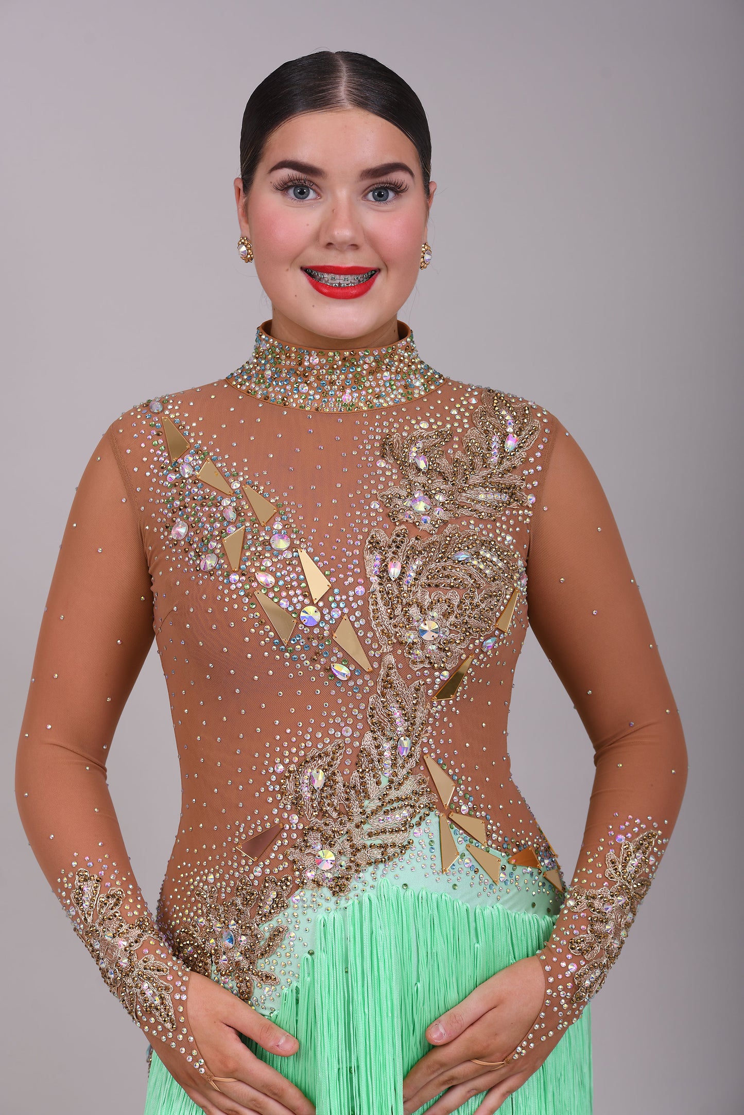 190 Tan mesh & mint Green High back Latin dress. Decorated with gold mirrors & AB stones.