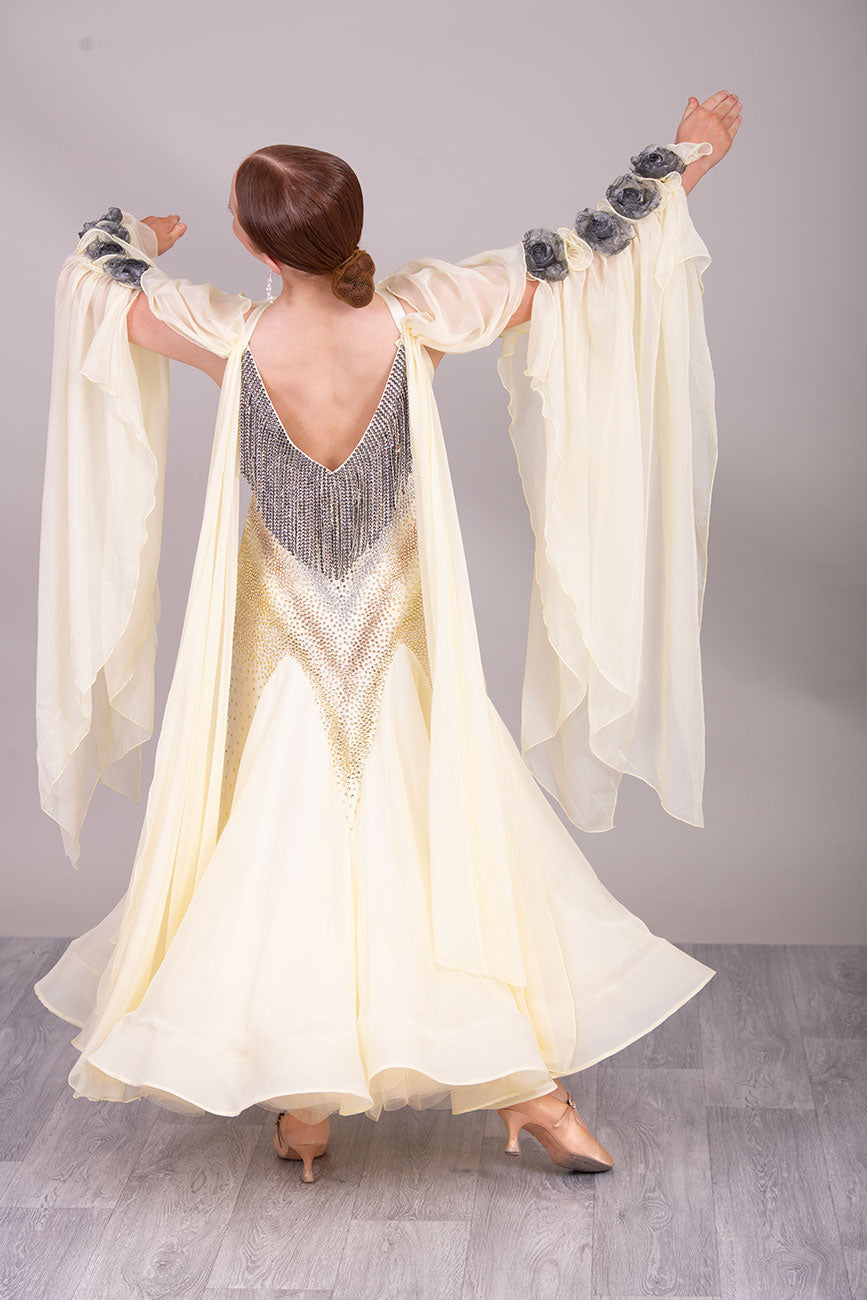 38B TWD PETITE Lemon & Silver Competition Ballroom/Sequence Dress
Stunning Flower detailing to the arm sleeve floats with 
Heavily stoned fabric droppers on the back. Very unusual neck/Shoulder