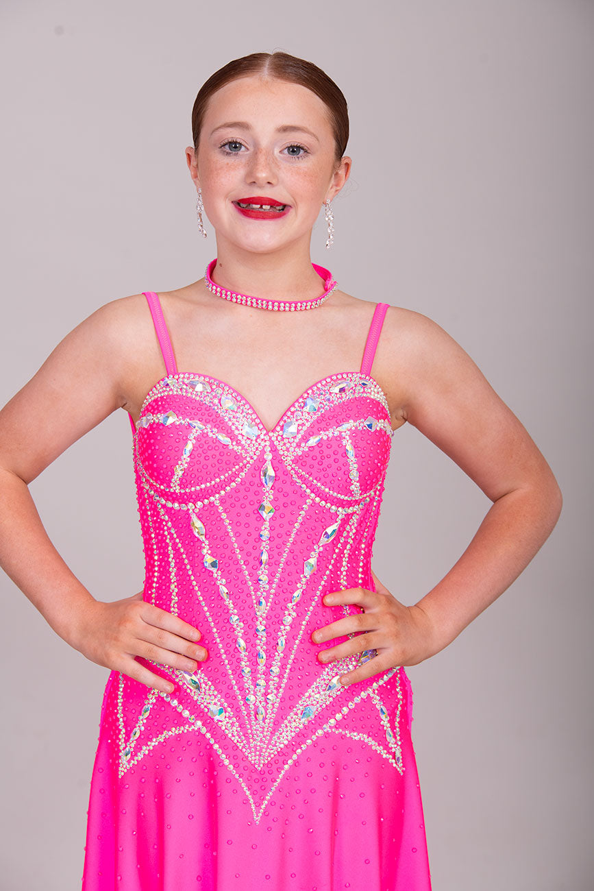 34L Neon Pink Corset style Competition Latin dance dress. Bra cup style bodice with corset effect stoning in AB. Dude splits edged in AB