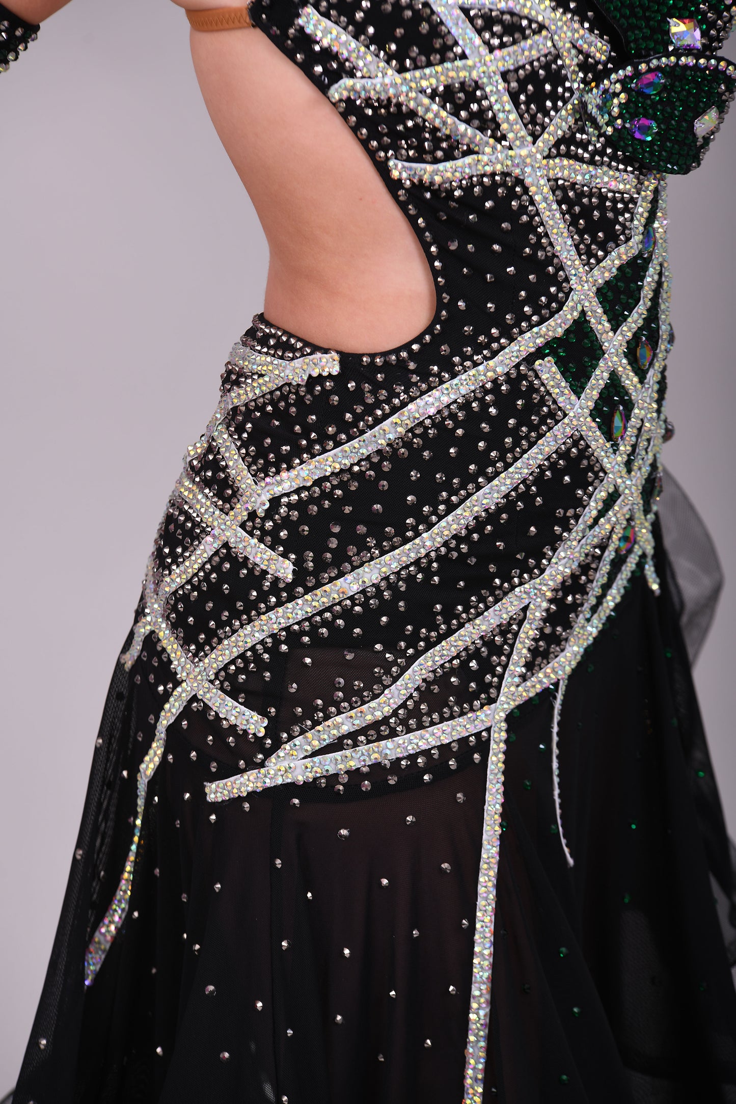 097 Black Heavily Stoned Gem Latin Dress. 3D design to the chest. Backless dress with crinoline edged skirt. Stoned in AB