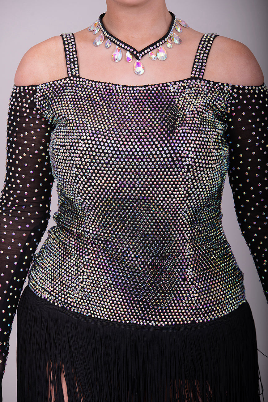 250 Black fringed skirt Latin dress. Solid AB stoning to bodice with cold shoulder black mesh stoned fingered sleeves