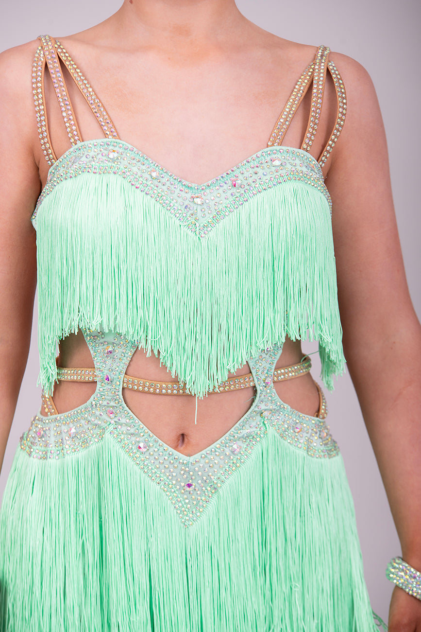 (BUDGET)2 Green Latin Competition Dance Dress. Full Fringed Skirts with shoulder & waist detailing. 2 Bangles included.                                     *****Our New Budget Range are Bought in ready made Costumes, with some detail added by TWDance*****