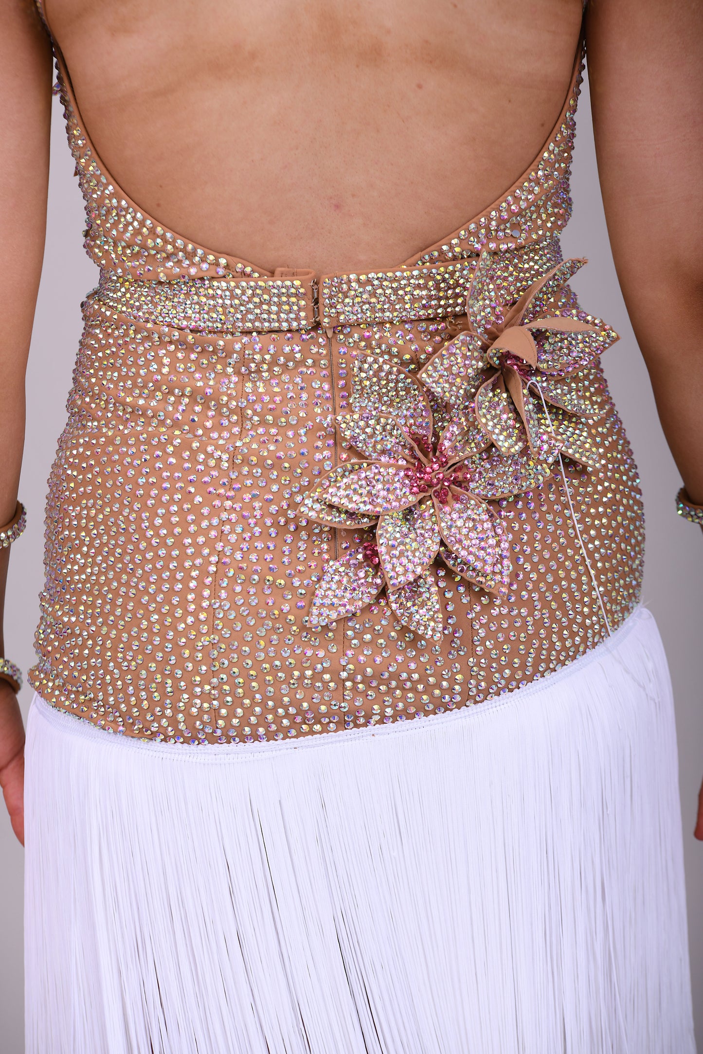 299 Tan & white Latin Dress. 3D flower detailing with white fringe skirt. AB & Rose stoning with separate belt.
