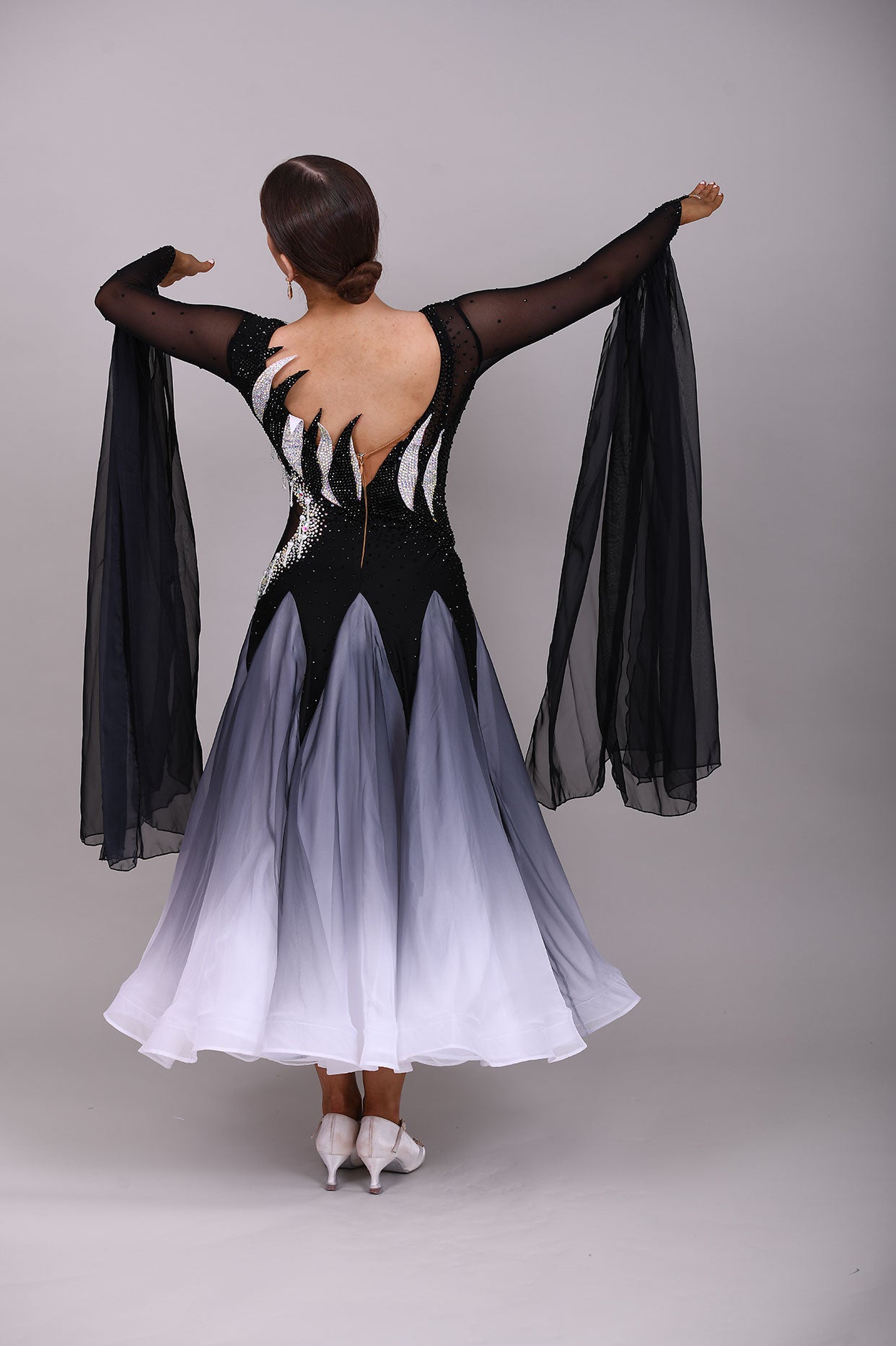 331 White & Black Ombré Ballroom Dress. Detailing to the chest and back. Decorated in Jet and AB stones with floats from the lower arm.