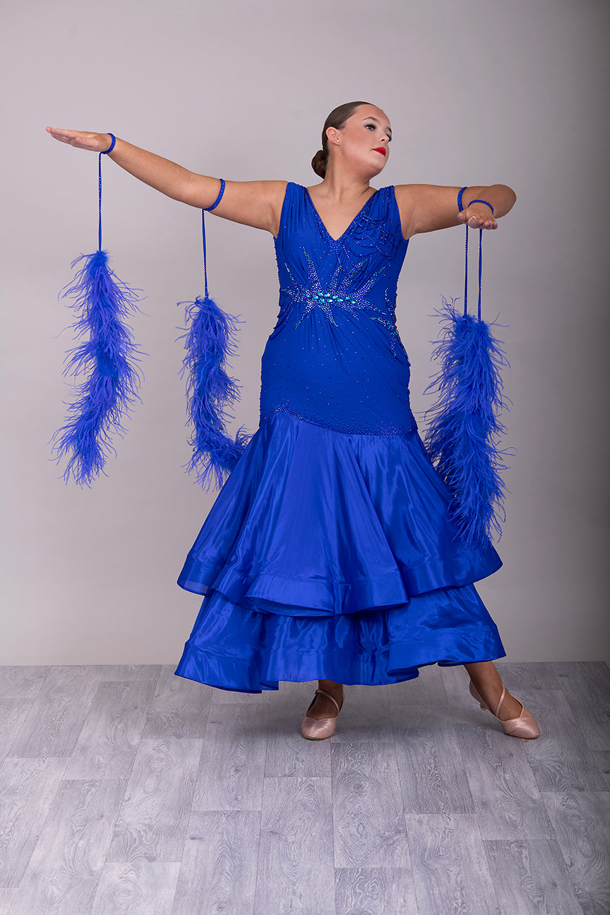 9000 Striking Bright Royal Blue Ballroom Dress. Decorated in sapphire, sapphire AB & aqua. Comes with x2 sets of Detachable floats & stunning necklace.
