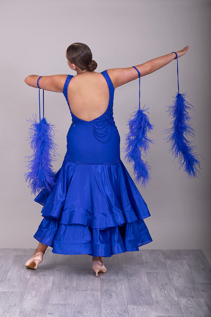 9000 Striking Bright Royal Blue Ballroom Dress. Decorated in sapphire, sapphire AB & aqua. Comes with x2 sets of Detachable floats & stunning necklace.