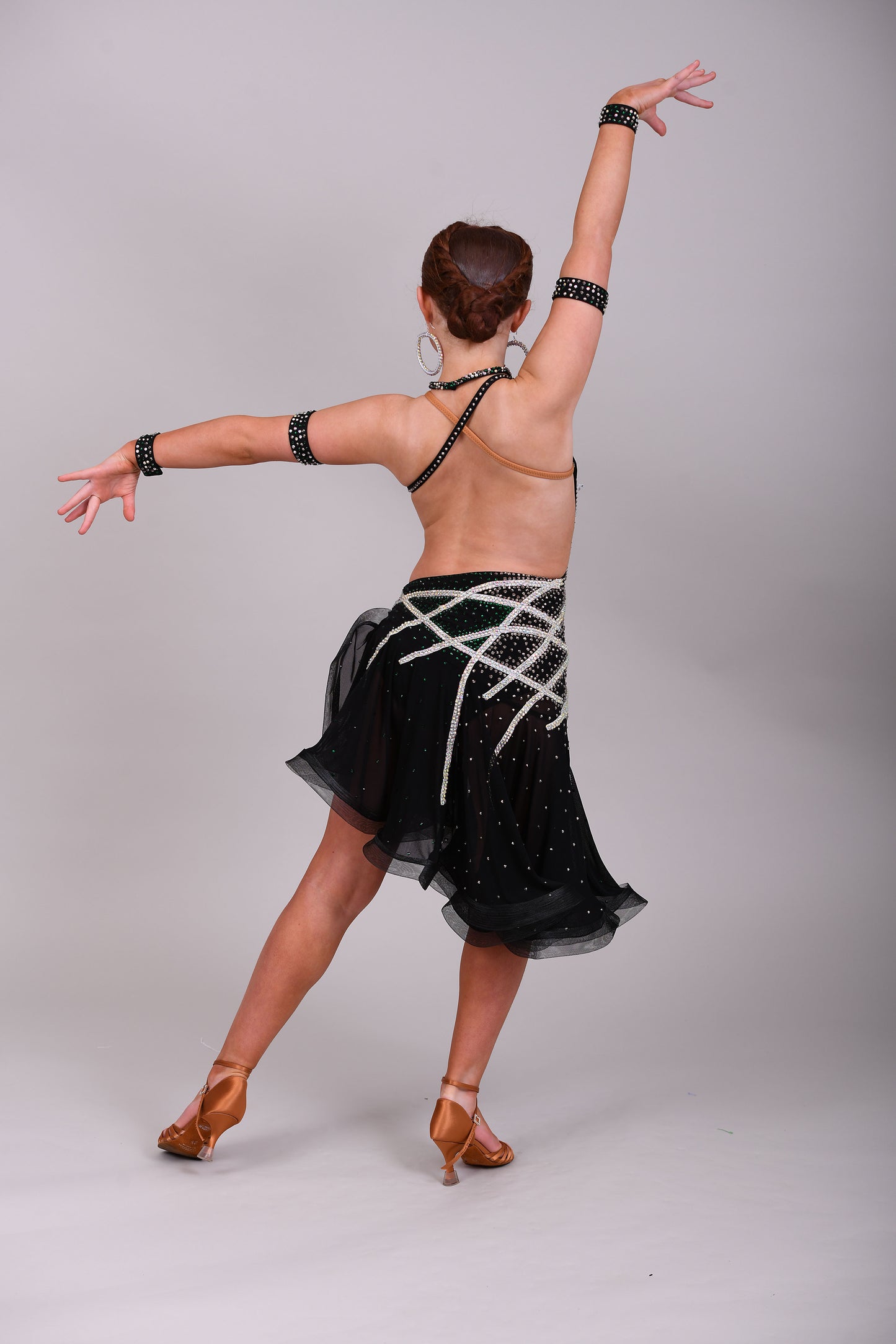 097 Black Heavily Stoned Gem Latin Dress. 3D design to the chest. Backless dress with crinoline edged skirt. Stoned in AB