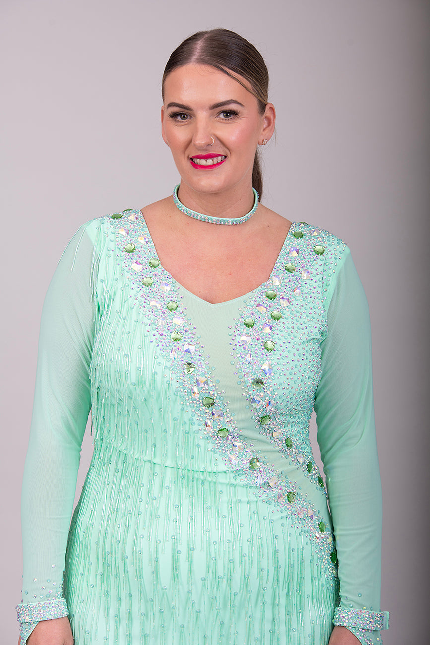 192 Mint Green Latin Dance Dress. Front mesh panel detail with flesh Lycra under so not see through. Stoned in AB and mint ab stones. Mint Green bead droppers. High back giving option to wear own bra.