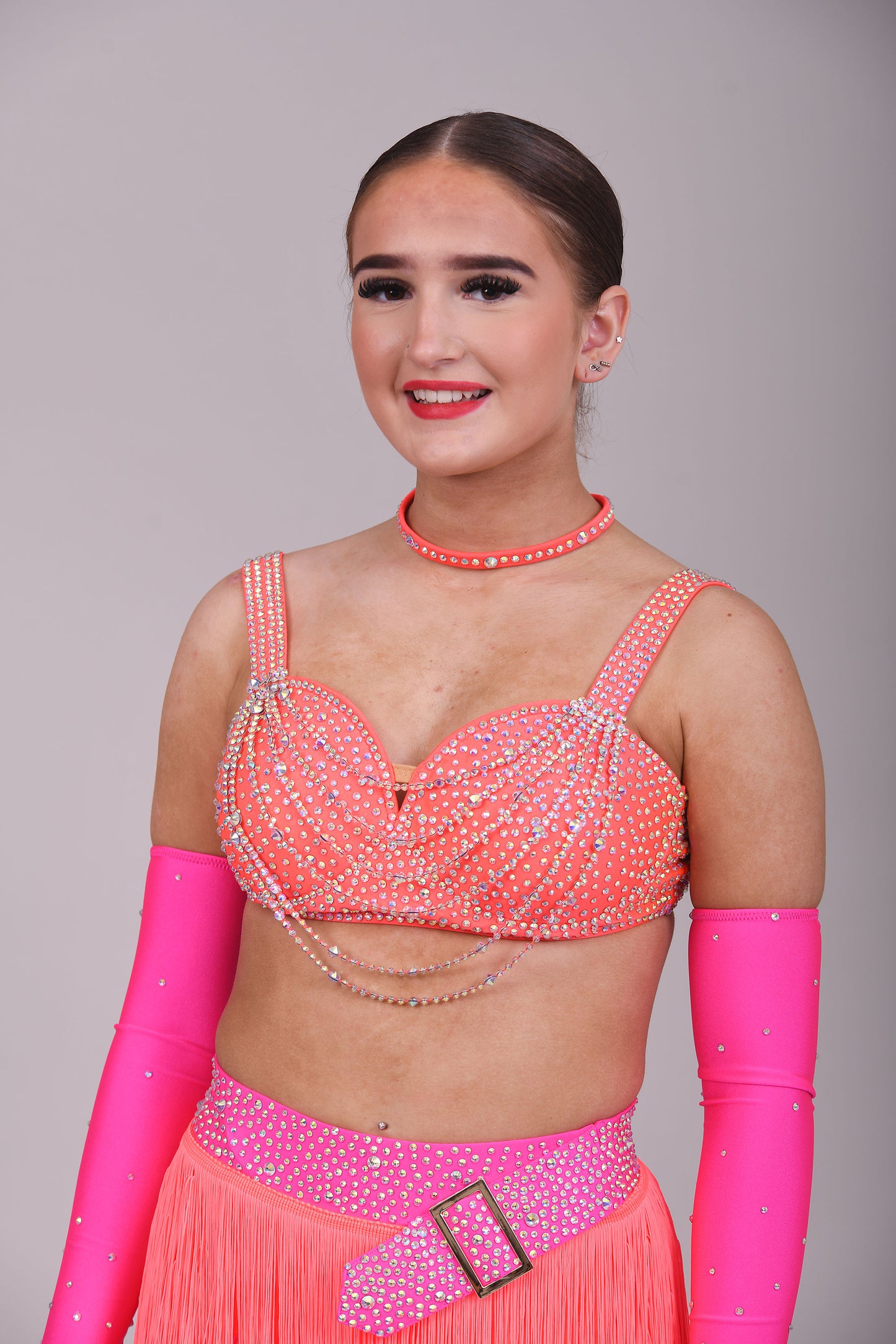 153 Flo Pink & Flo Orange Latin Dance Dress 2 Piece. Comes with separate gloves. Heavily stoned in AB with belt detail to the skirt