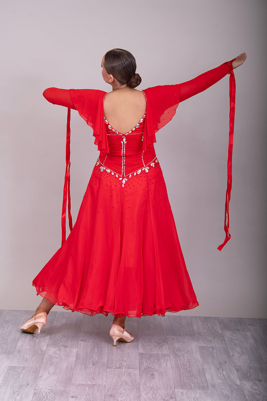 340 Red Rouched Bodice Ballroom Dress. Frill detail to top of sleeve with detachable ribbon floats. Detailed necklace. Decorated in Siam and AB stones.