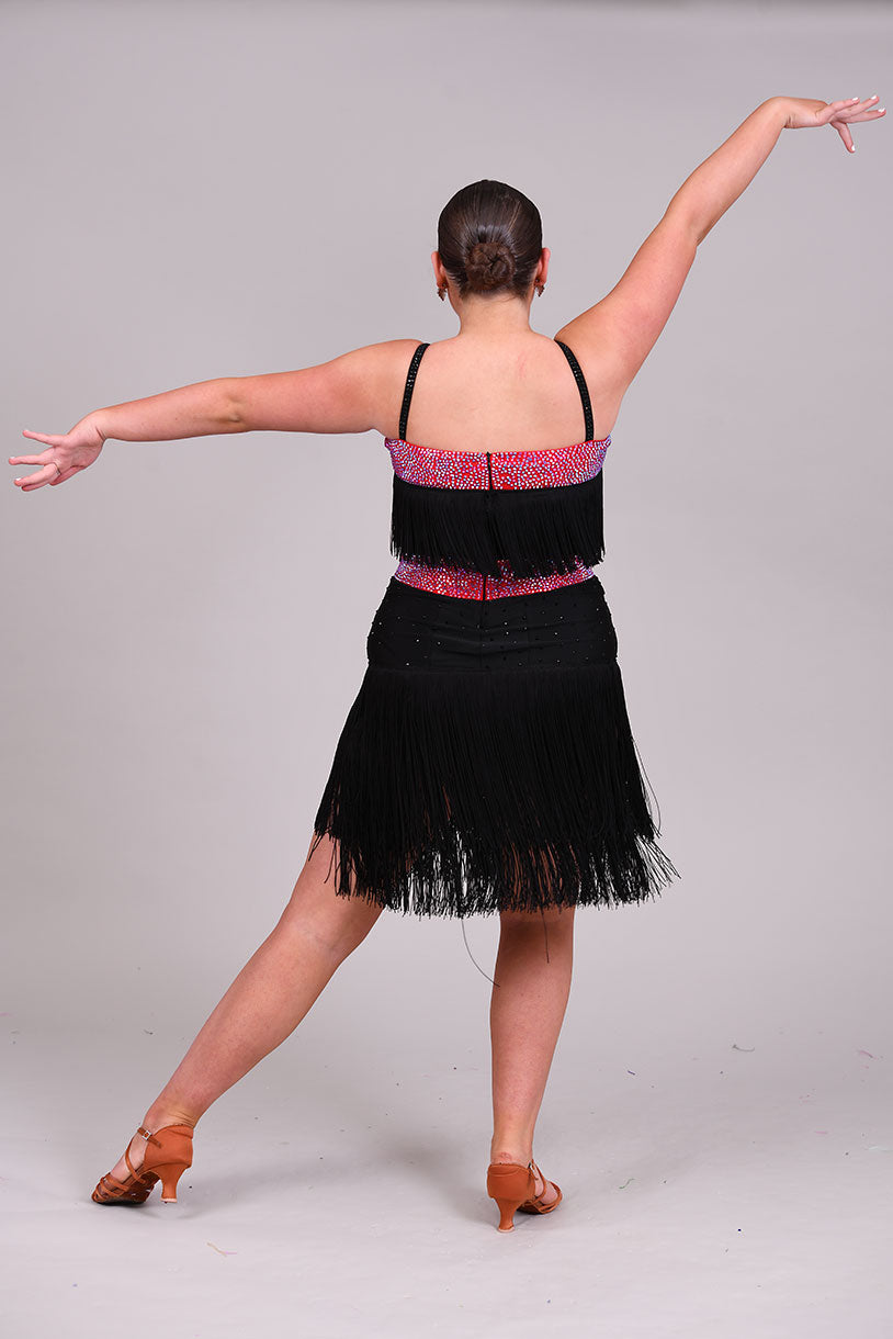 152 Black Latin Dress with full fringe skirt and fringe detailing to the bodice.  Cerise Belt and upper chest panels decorated in Siam AB stones