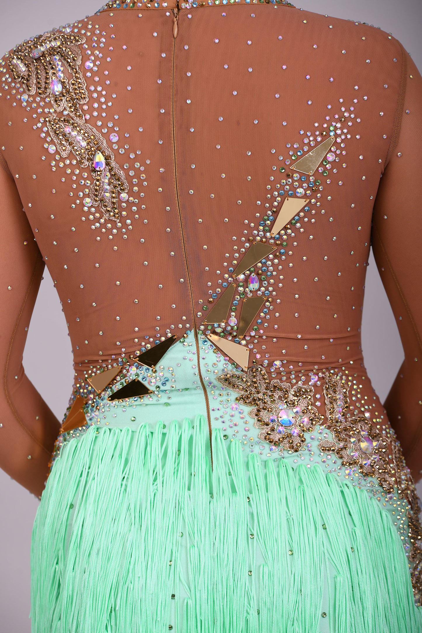 190 Tan mesh & mint Green High back Latin dress. Decorated with gold mirrors & AB stones.