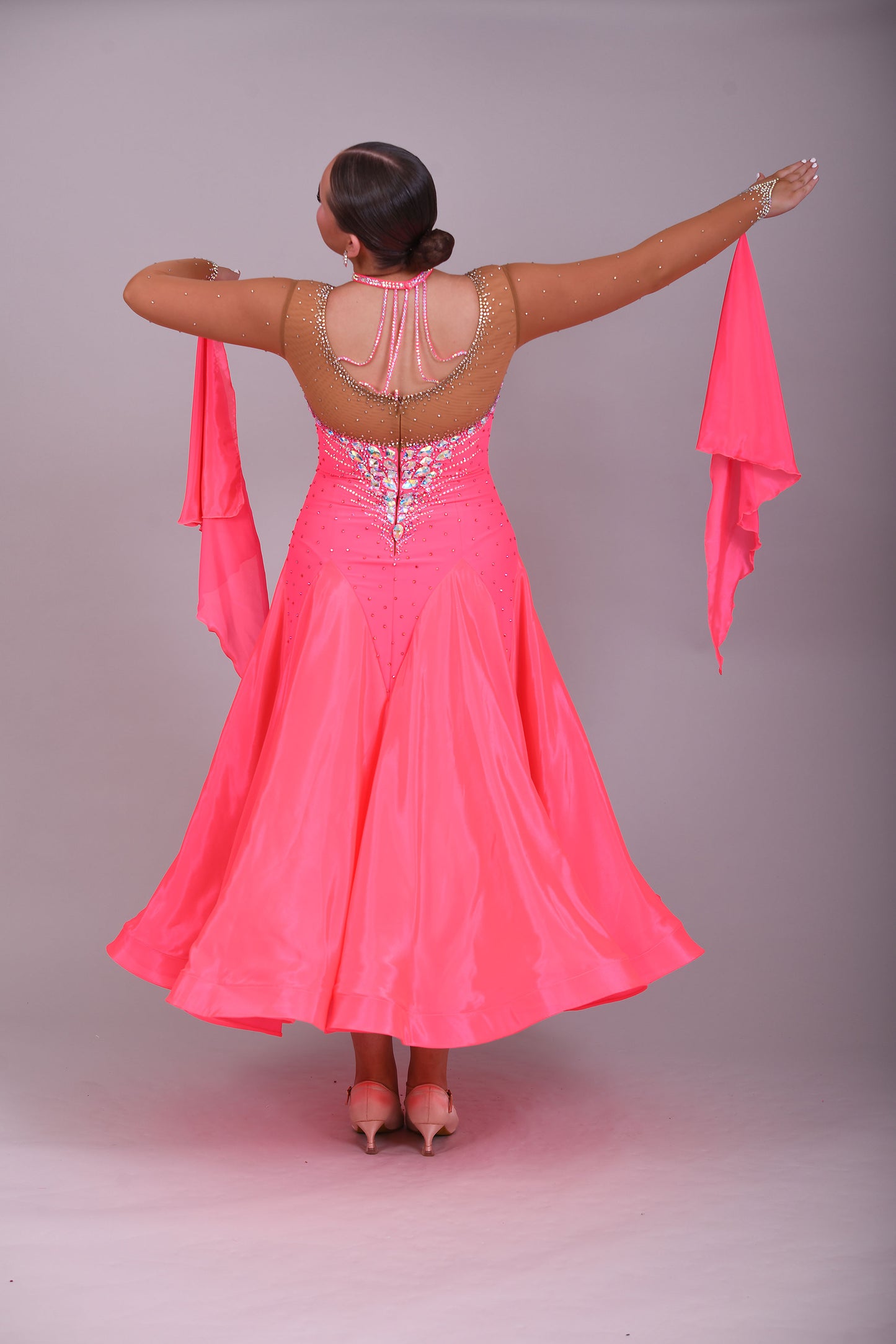 004 Coral Competition Ballroom Dance Dress. Heavily stoned in AB, pink AB & Golden Shadow. Strapping detail to the back. Comes with detachable floats.