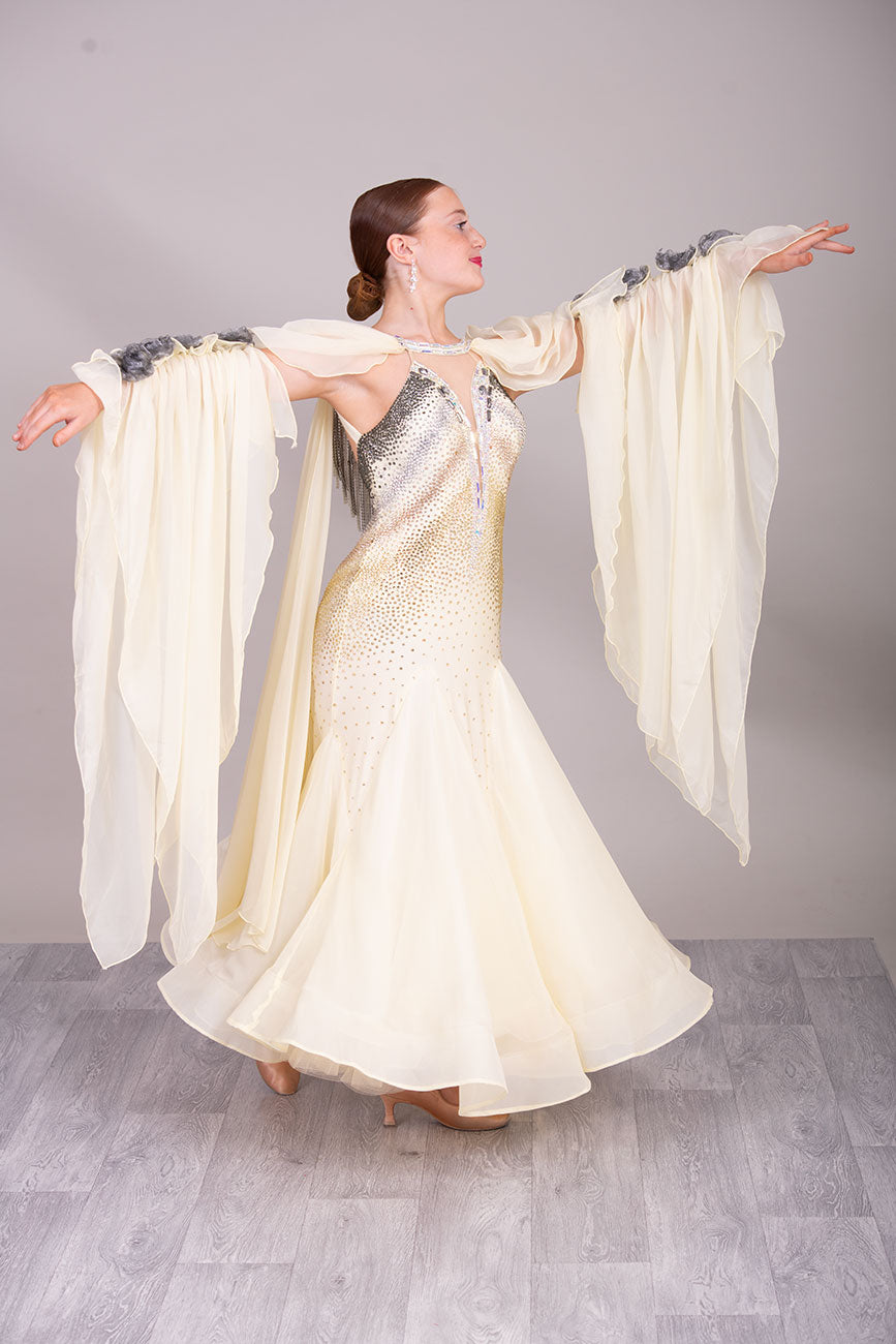 38B TWD PETITE Lemon & Silver Competition Ballroom/Sequence Dress
Stunning Flower detailing to the arm sleeve floats with 
Heavily stoned fabric droppers on the back. Very unusual neck/Shoulder