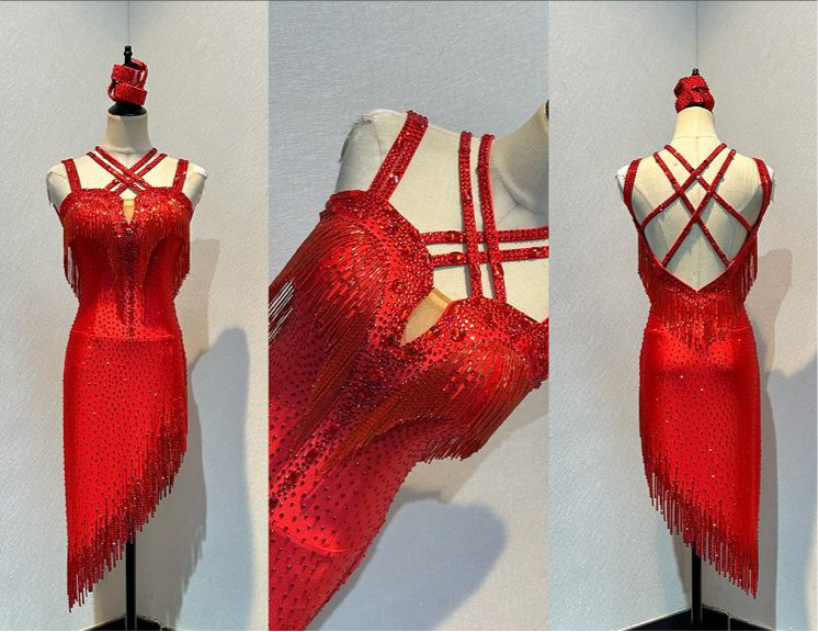 41L Red Latin Competition Dance Dress. Stoned in light Siam with strapping feature to the back & front. Bead droppers added to the hem for movement & upper chest.