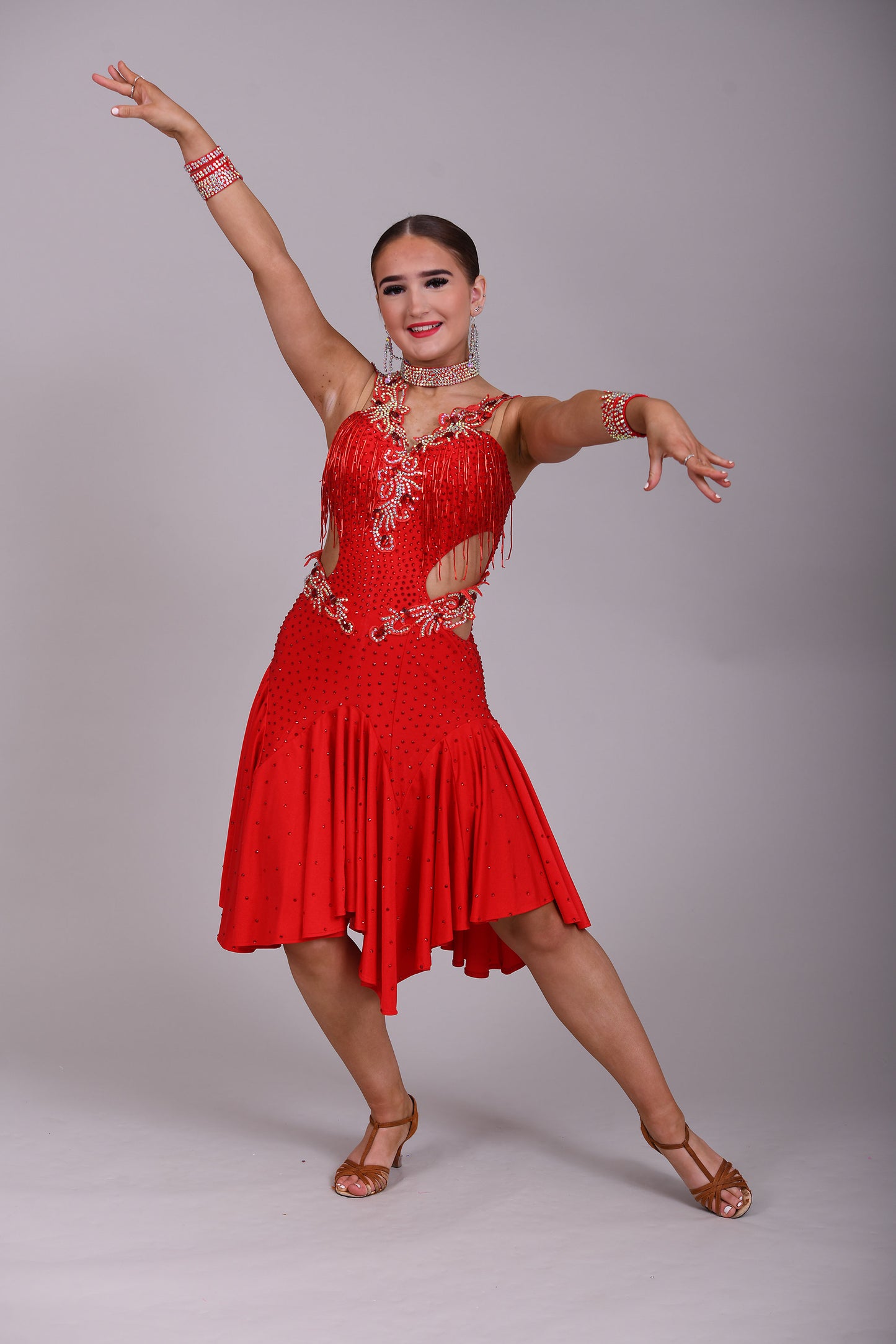 206 Red Lycra Dress with super full skirts. Motif detailing to back. Decorated with Siam bead droppers, cut out sides decorated in Siam & AB stones