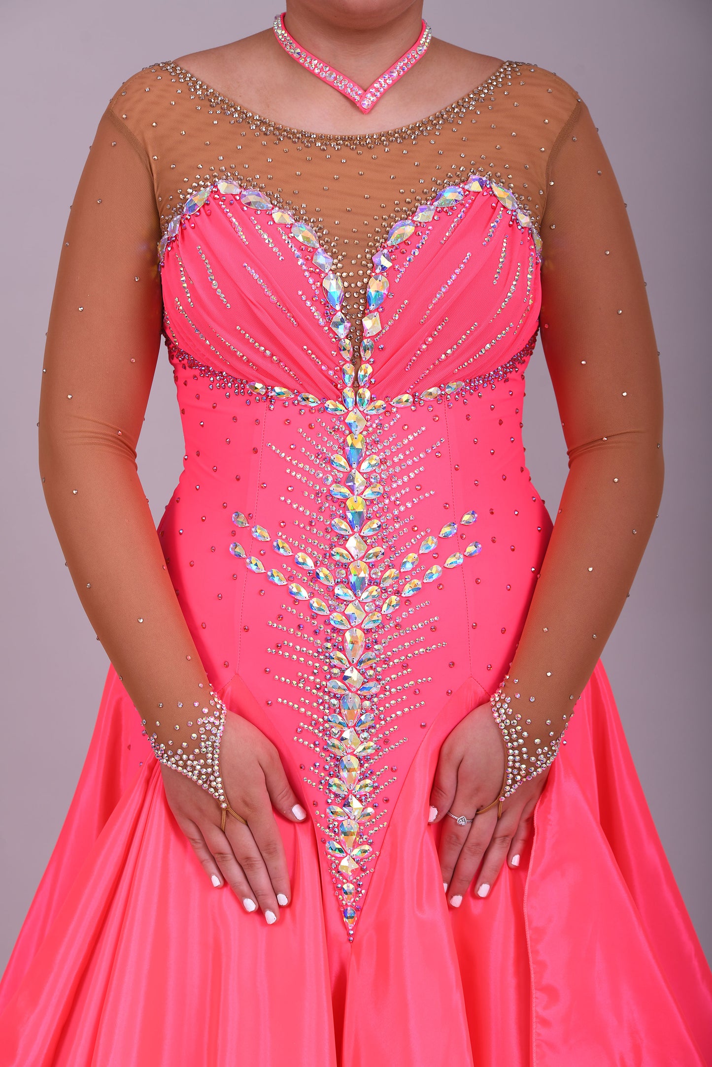 004 Coral Competition Ballroom Dance Dress. Heavily stoned in AB, pink AB & Golden Shadow. Strapping detail to the back. Comes with detachable floats.
