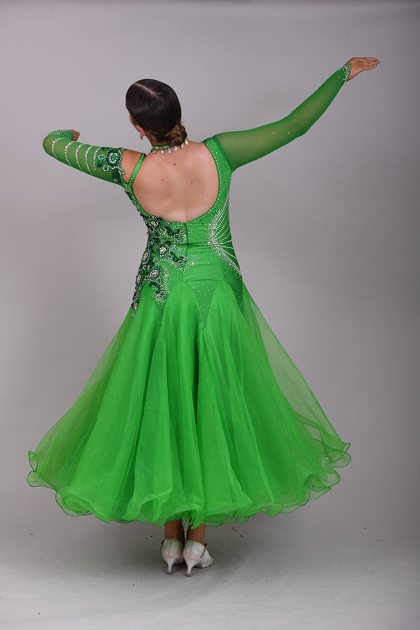 010 Apple Green one Shoulder, one cold shoulder Ballroom Dress. Appliqué stoned in AB & Jade to one side of the bodice.