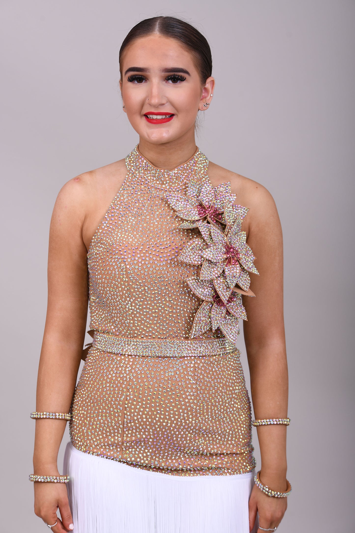 299 Tan & white Latin Dress. 3D flower detailing with white fringe skirt. AB & Rose stoning with separate belt.