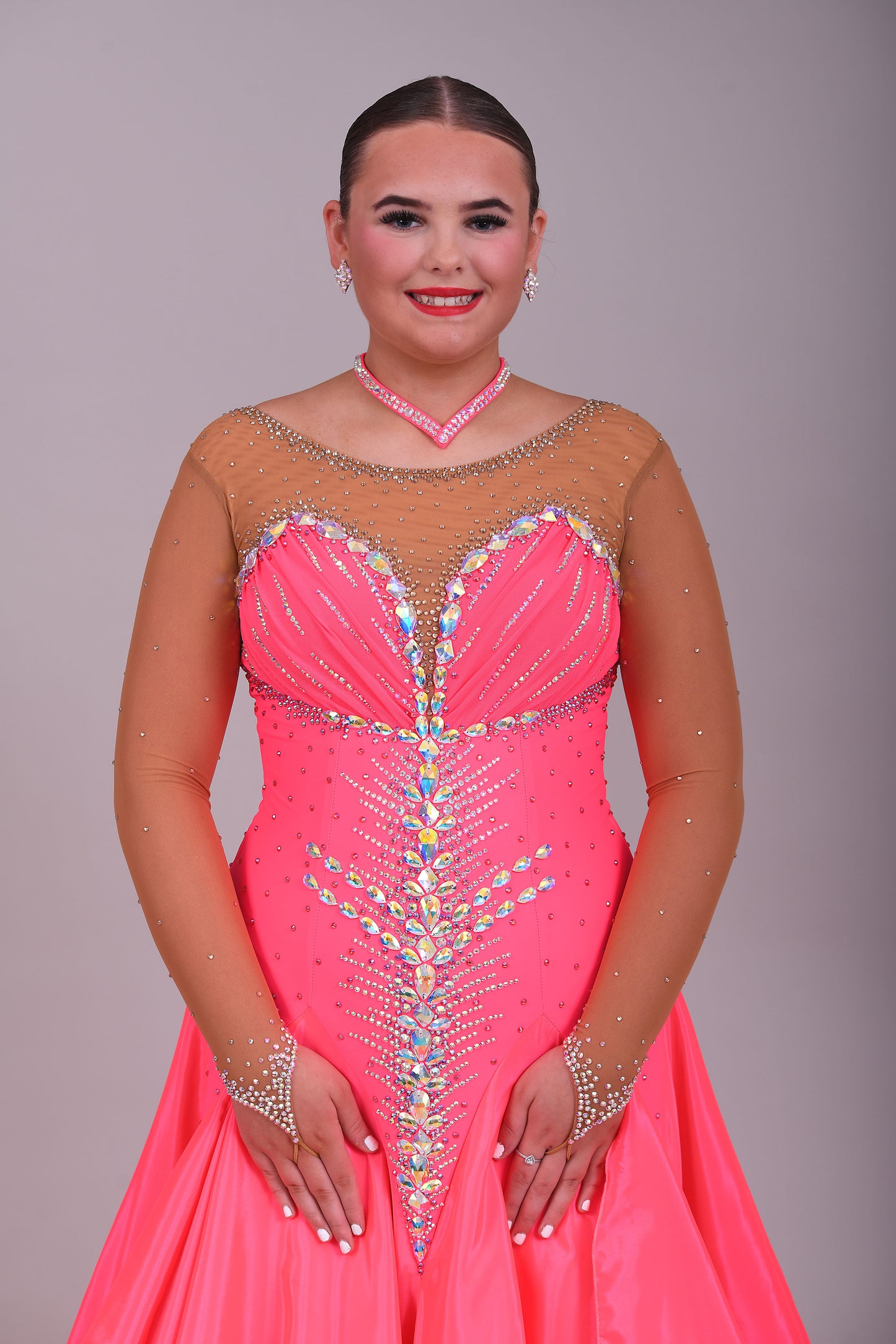 004 Coral Competition Ballroom Dance Dress. Heavily stoned in AB, pink AB & Golden Shadow. Strapping detail to the back. Comes with detachable floats.