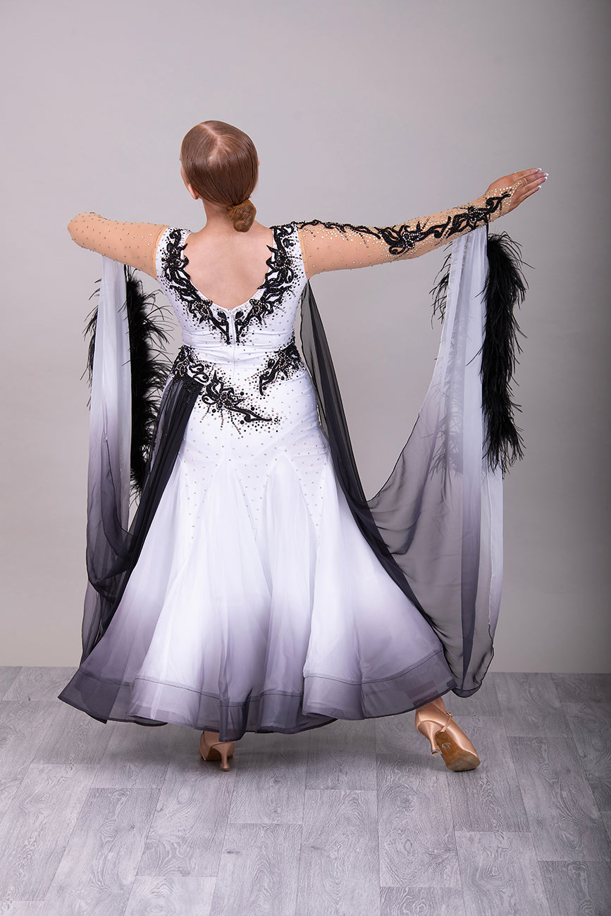 048 White Ballroom Dress with Black lace detailing to the upper chest & sides. Comes with x2 cuffs decorated with appliqué. Stoned in AB and Jet