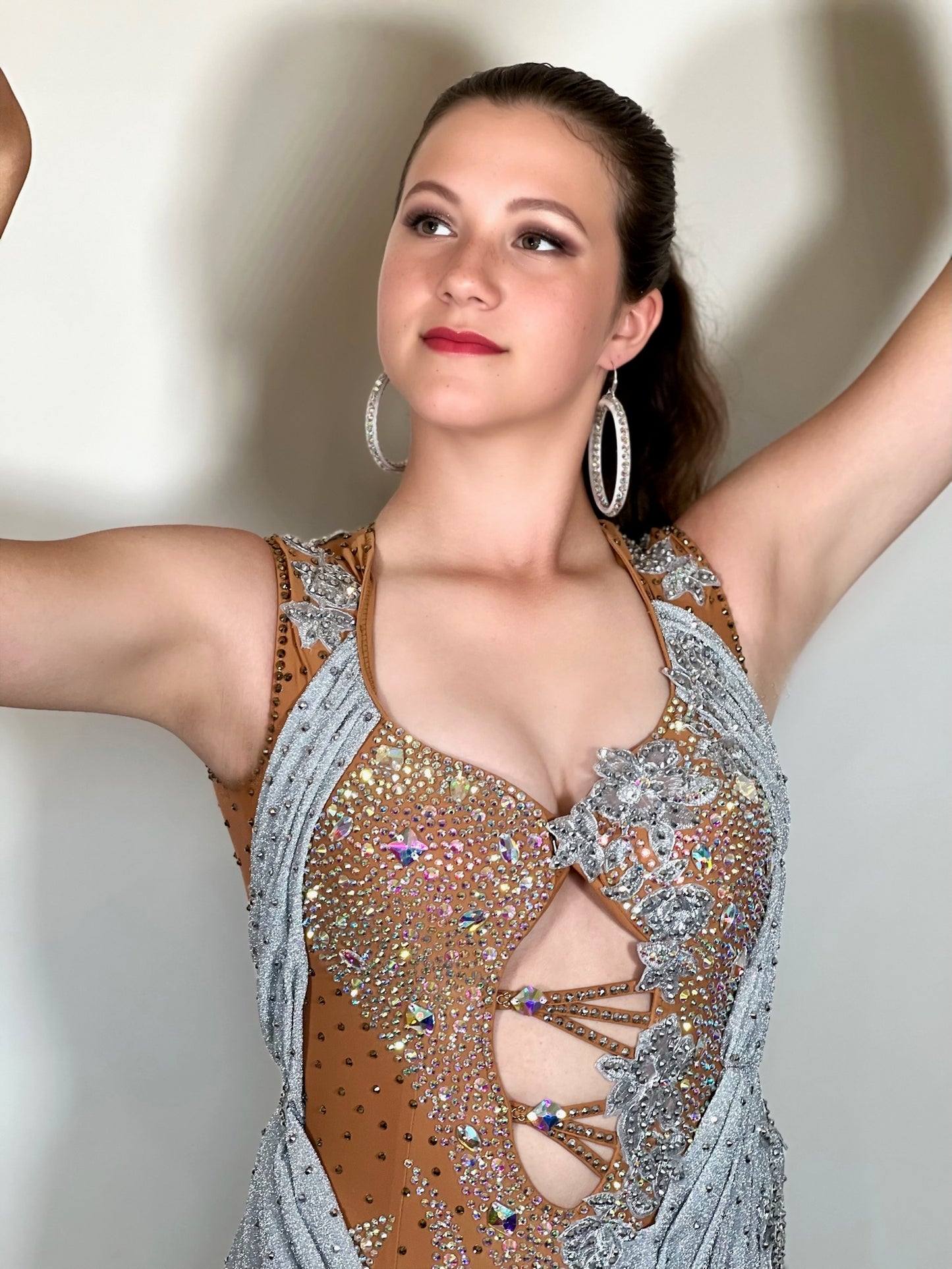 346 Silver Heavily decorated Latin Dress. Decorated with lilac flowers with full back. Front fastening. Decorated with silver motifs & AB stones