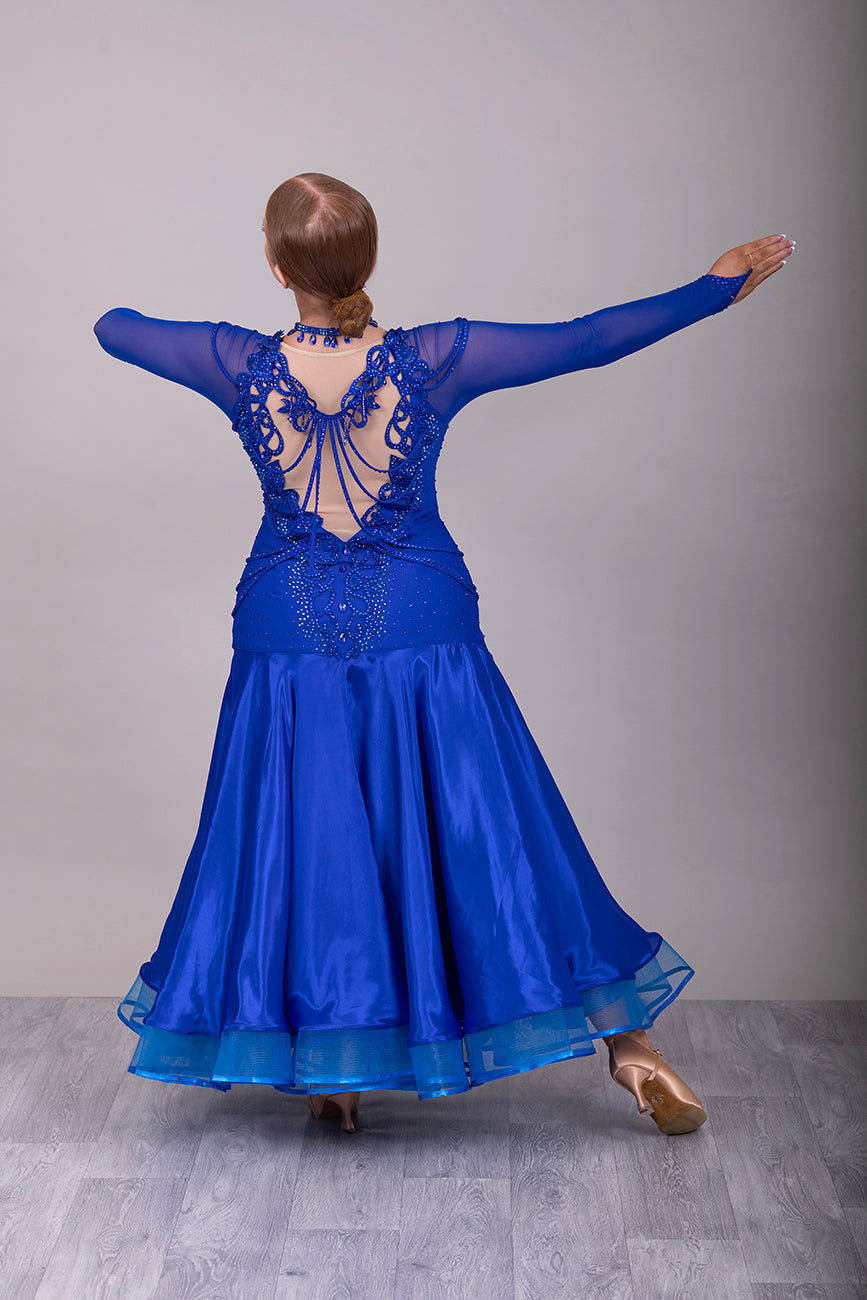 339 Bright Royal Blue Ballroom Dress. Stunning detailing to the back with Strappy detail to the hips. Organza edged in ribbon. All stoned in Bright Royal Blue. Very comfortable Front Zip fastening.