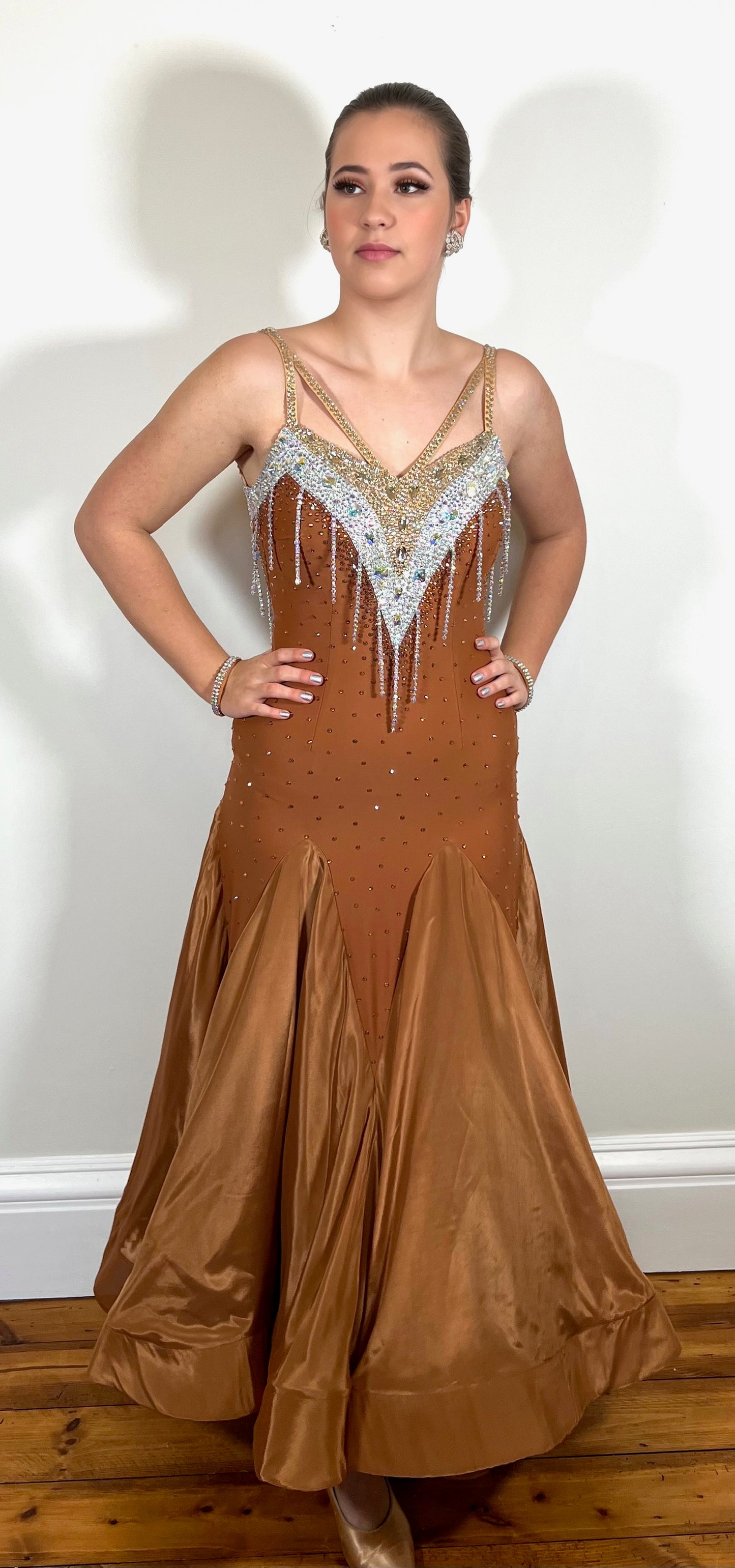 246 Cappuccino Ballroom Dress. Comes with Gloves & detachable glove floats. Stoned in Aurum, Sunshine, Smoked Topaz & Topaz. Strap feature to the back & shoulders