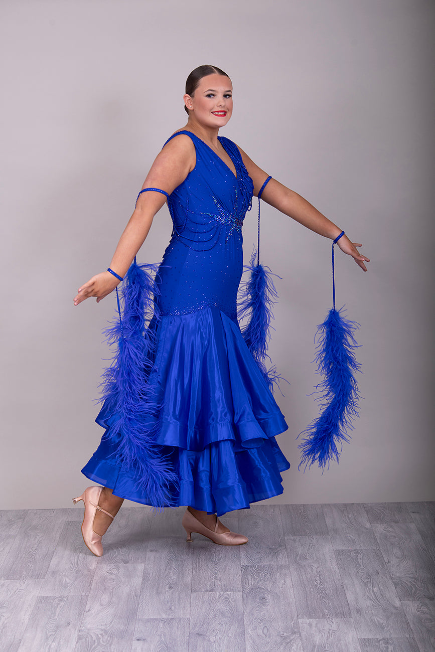 9000 Striking Bright Royal Blue Ballroom Dress. Decorated in sapphire, sapphire AB & aqua. Comes with x2 sets of Detachable floats & stunning necklace.