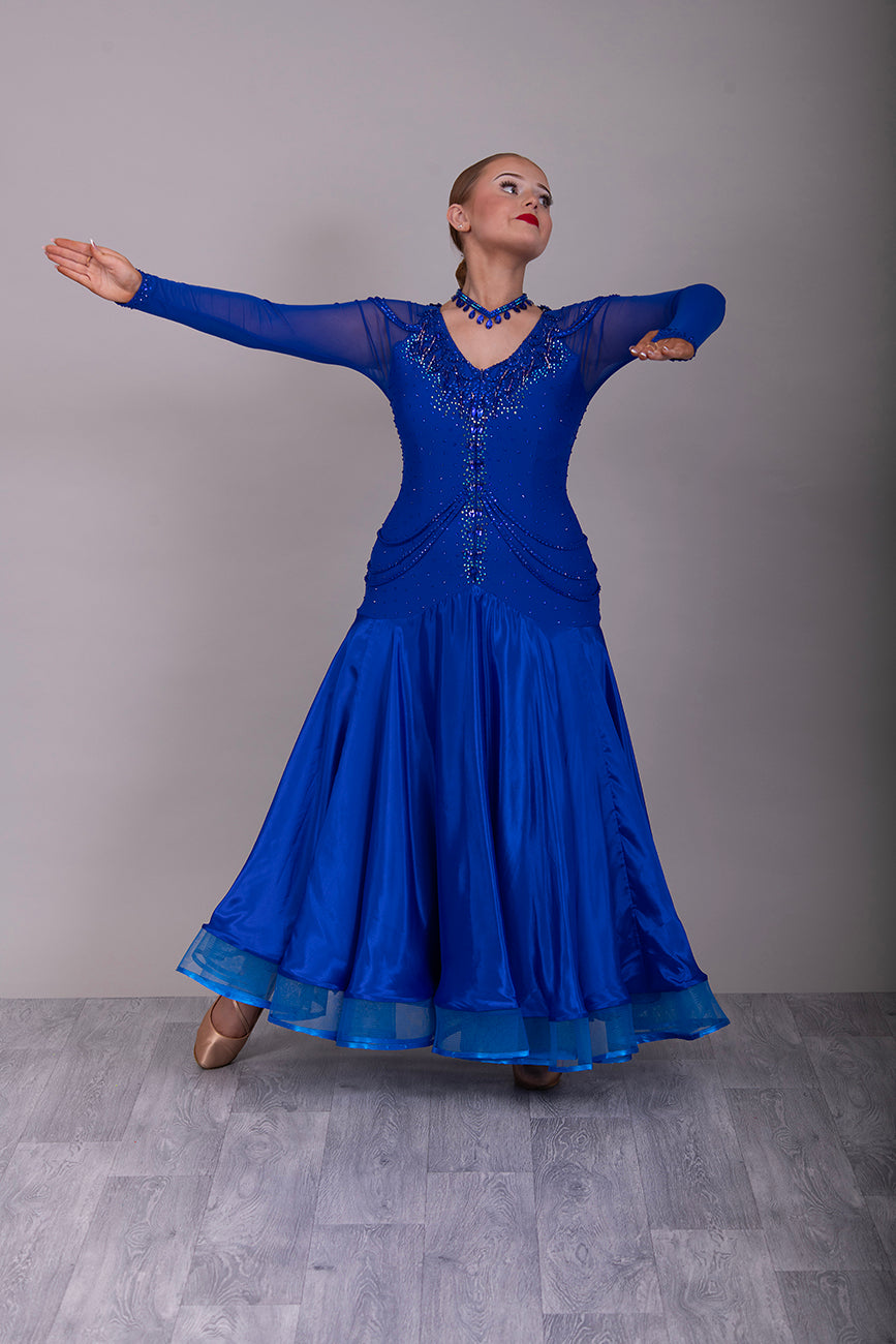 339 Bright Royal Blue Ballroom Dress. Stunning detailing to the back with Strappy detail to the hips. Organza edged in ribbon. All stoned in Bright Royal Blue. Very comfortable Front Zip fastening.