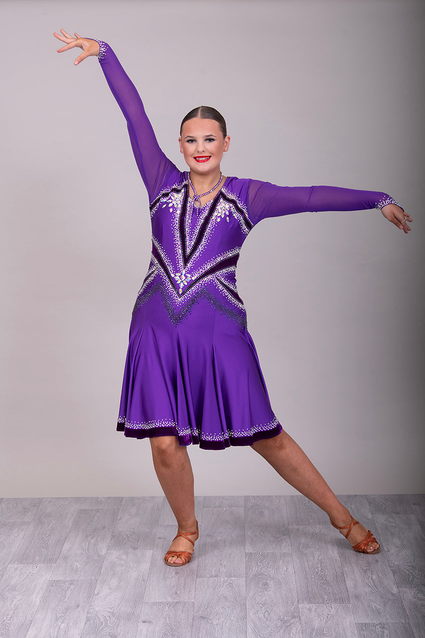 041 Cadbury Purple Competition Latin Dance Dress. Deep purple contrast pattern heavily stoned in AB & Amethyst AB. Bold & Flattering design. Full skirt giving maximum movement.