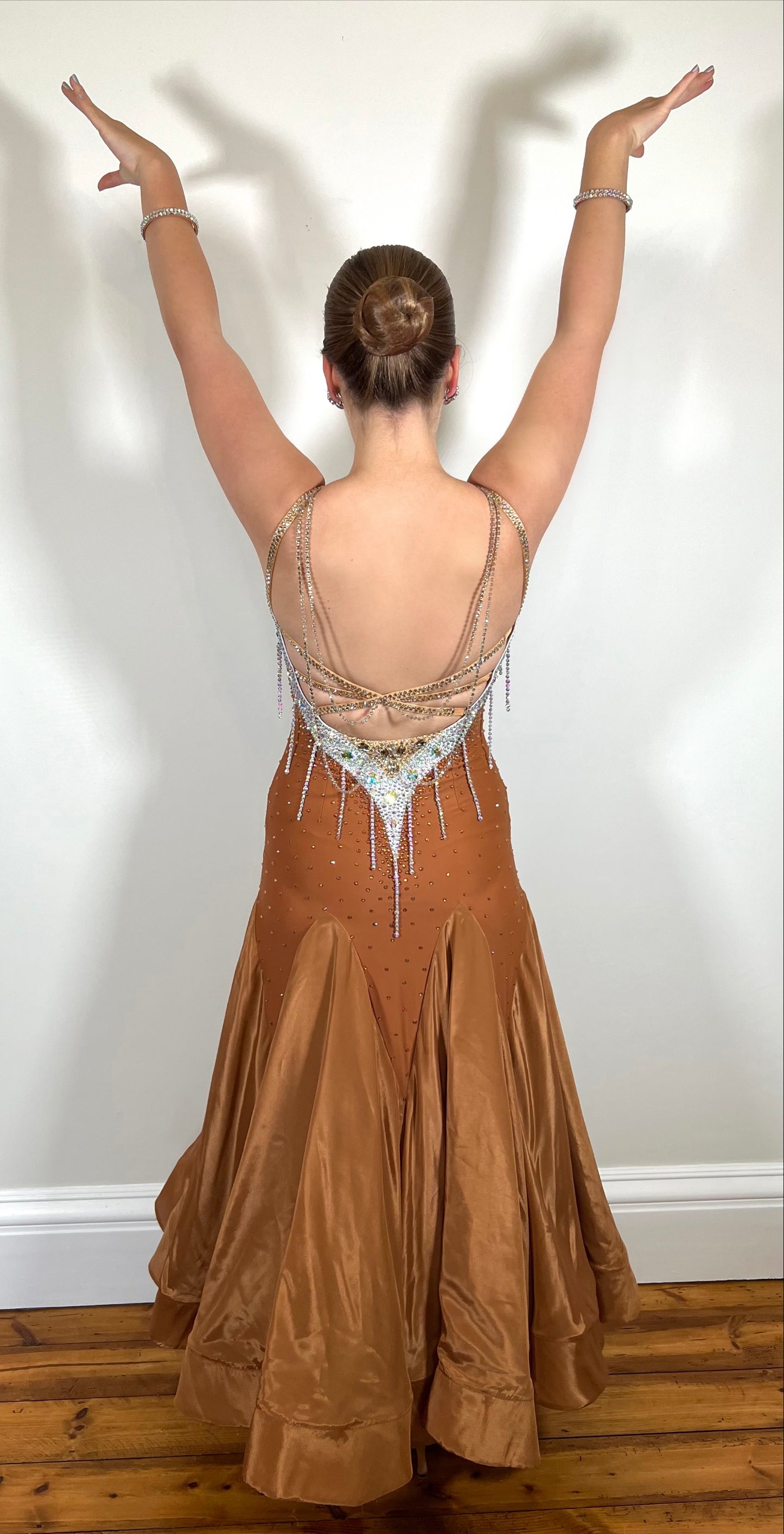 246 Cappuccino Ballroom Dress. Comes with Gloves & detachable glove floats. Stoned in Aurum, Sunshine, Smoked Topaz & Topaz. Strap feature to the back & shoulders