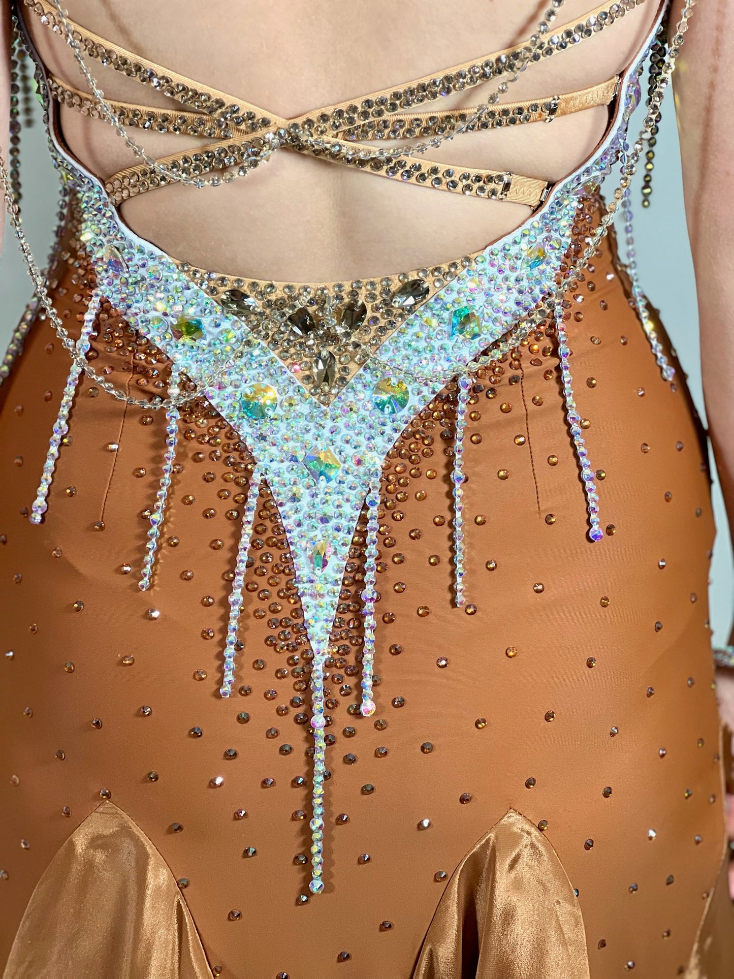 246 Cappuccino Ballroom Dress. Comes with Gloves & detachable glove floats. Stoned in Aurum, Sunshine, Smoked Topaz & Topaz. Strap feature to the back & shoulders