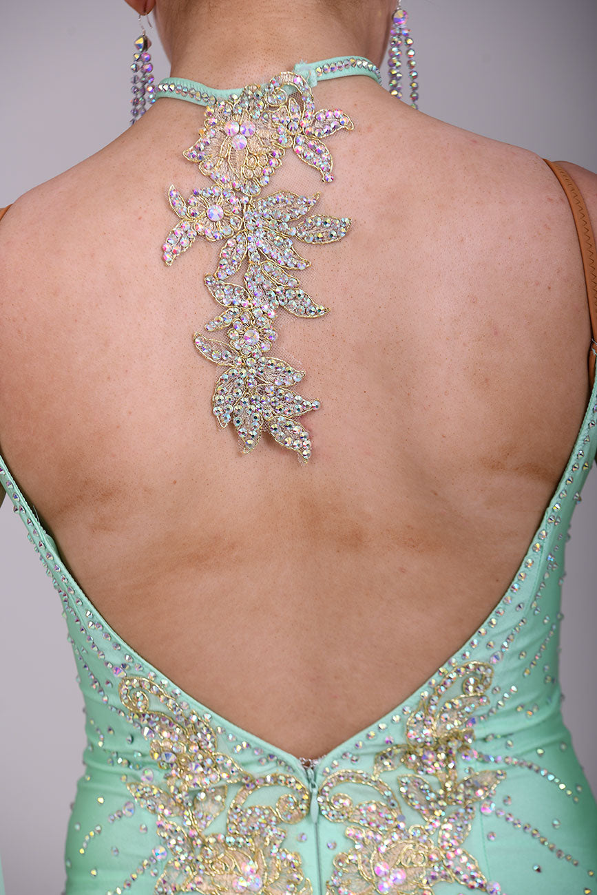327 mint Green & Gold Ballroom Dress. Decorated with Gold motifs & AB Stones. Comes with separate floaty sleeve cuffs.
