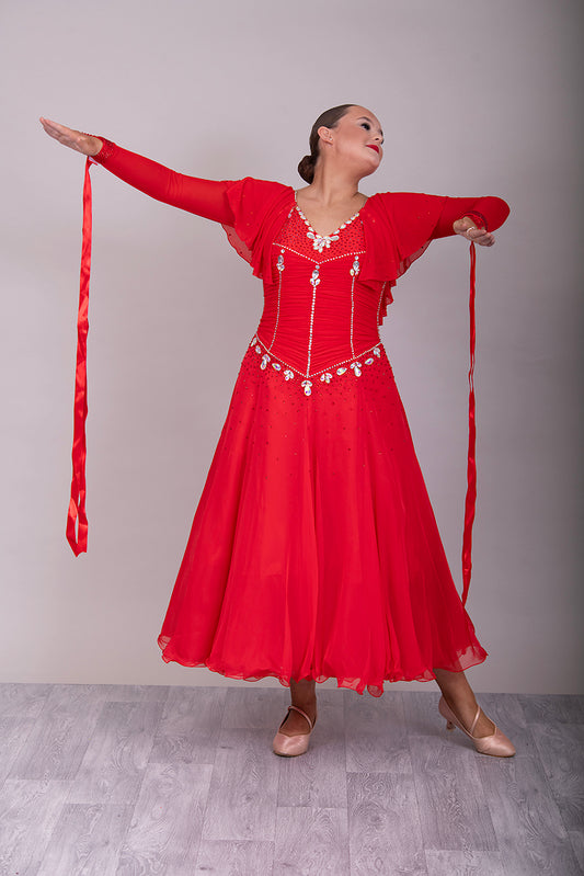 340 Red Rouched Bodice Ballroom Dress. Frill detail to top of sleeve with detachable ribbon floats. Detailed necklace. Decorated in Siam and AB stones.