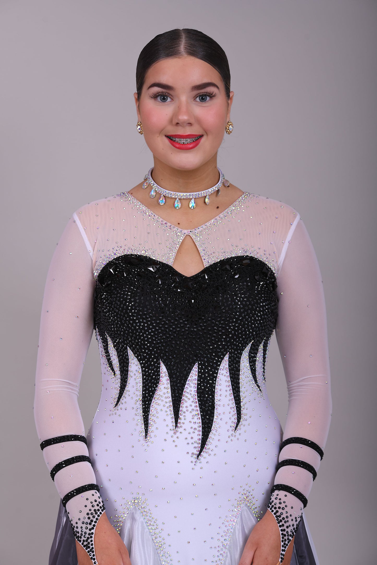 01140 Black & White Ombre Competition Ballroom Dance Dress Upper chest heavily stoned Jet. Pearl Chiffon Ombre skirts. The upper chest is white mesh with skin fabric underneath, giving the illusion of skin. Detachable Floats.