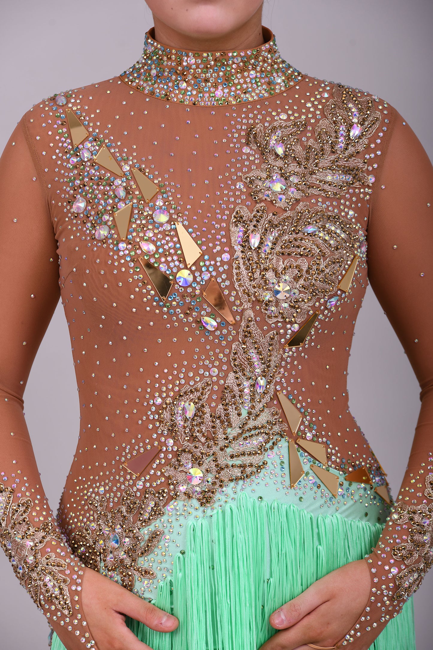 190 Tan mesh & mint Green High back Latin dress. Decorated with gold mirrors & AB stones.