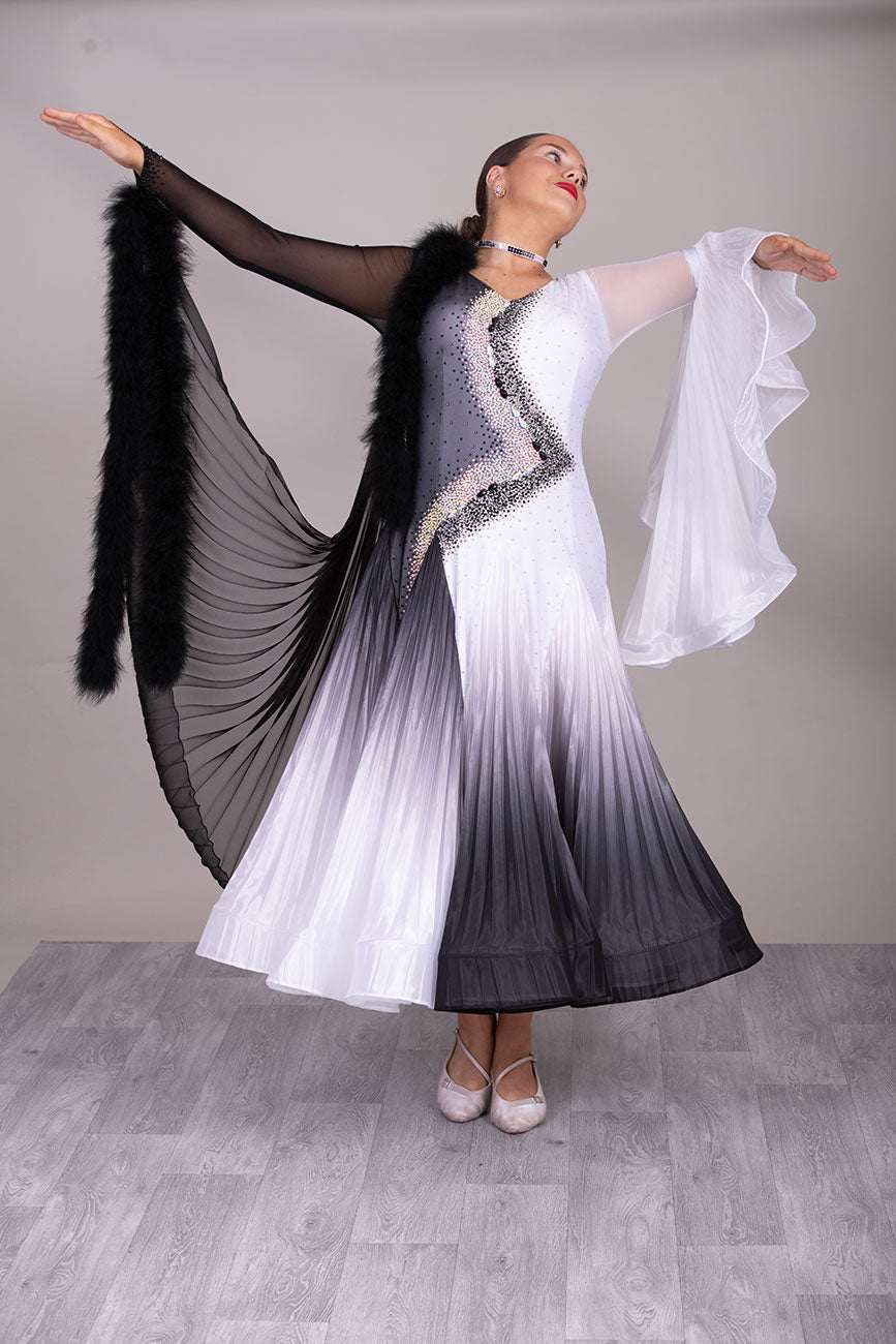 33B  “TWD ELITE” Ballroom/Sequence Competition Dance Dress
High Back allowing option to wear own Bra. Pleated Skirts in Black & White Ombre Pearl Chiffon. Pleated bell sleeve to 1 arm. Finger loop can be added. 
❤️Showroom Appointment Available❤️